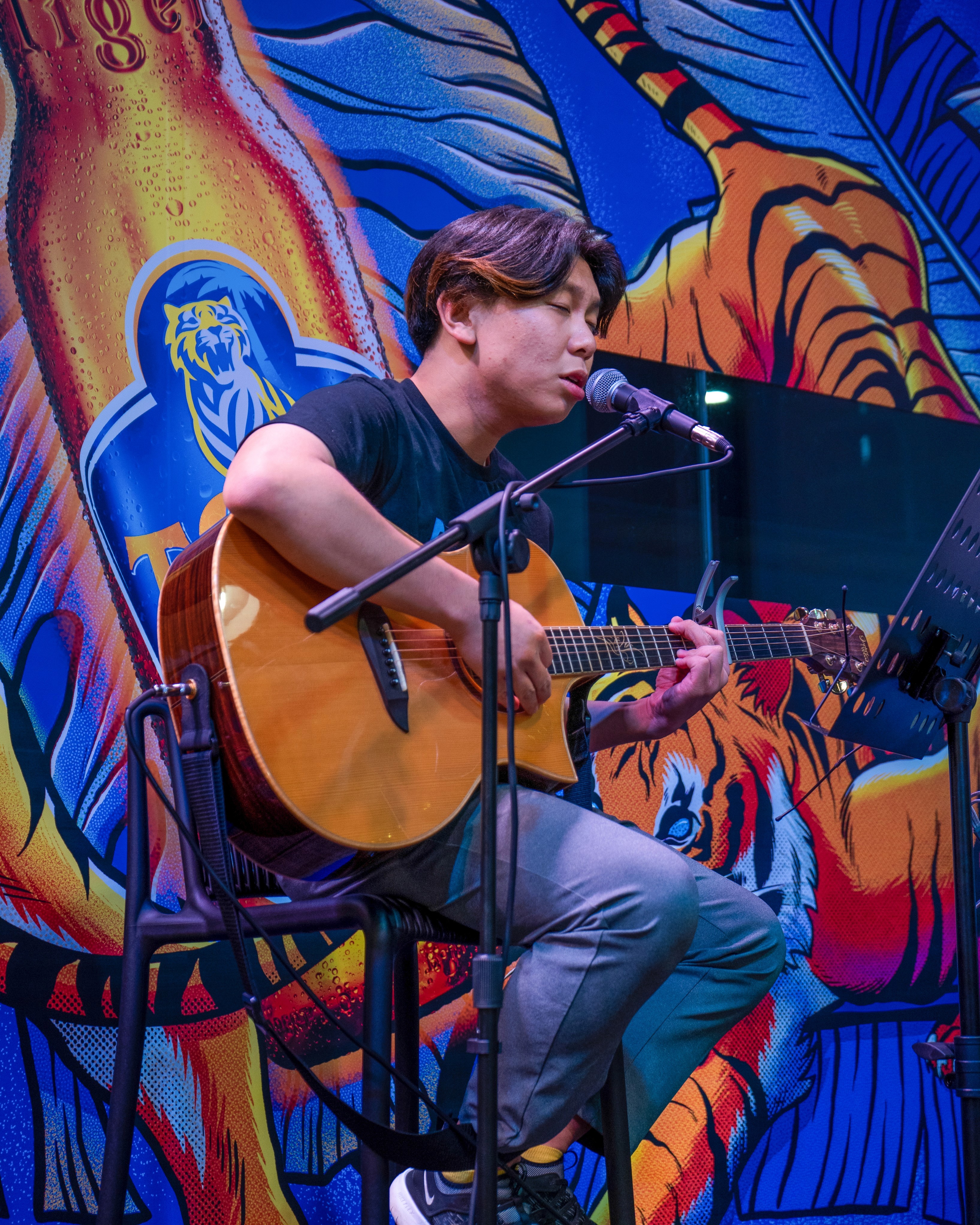 Ezekiel performing on stage at a pub restaurant