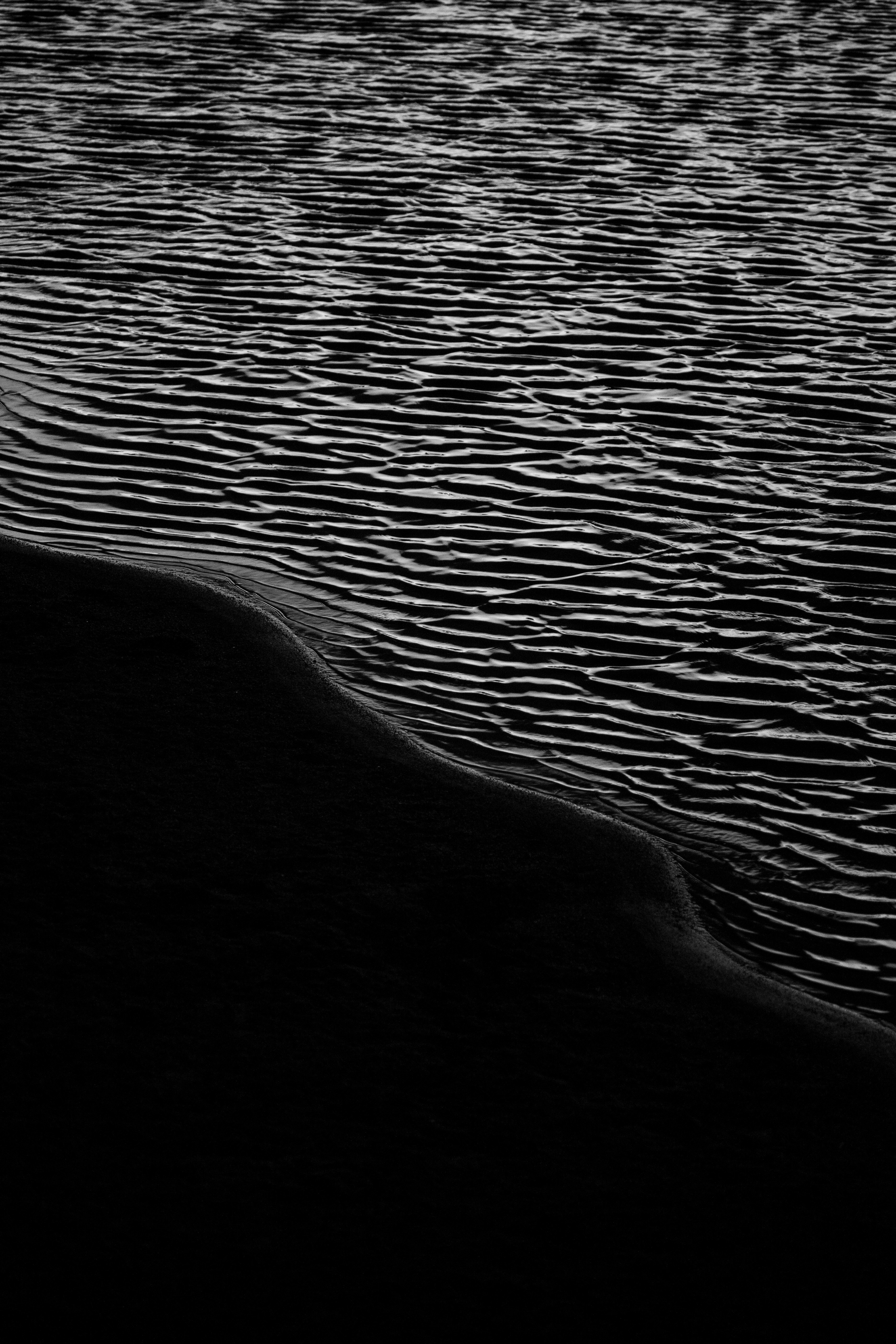 a black and white photo of a body of water