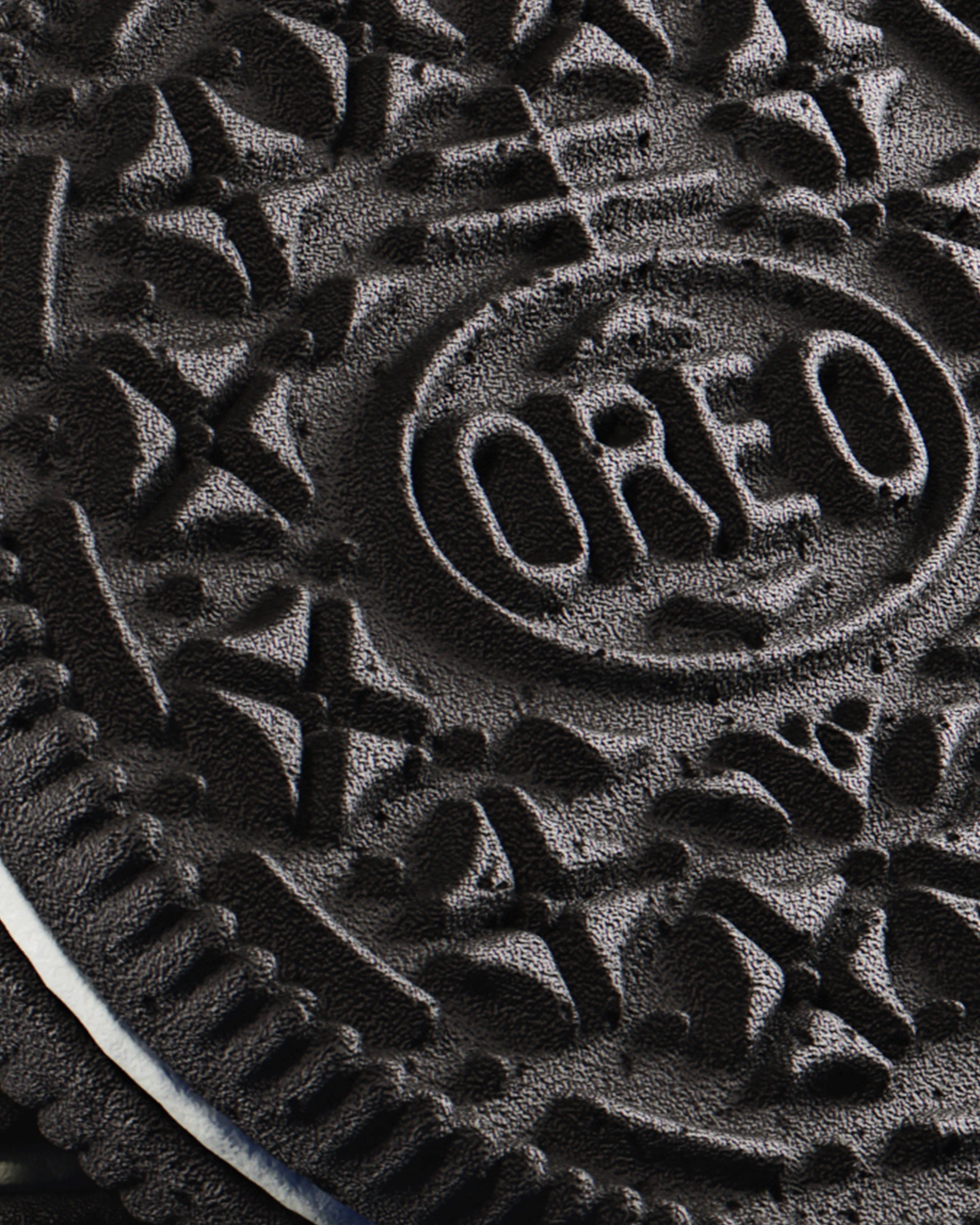 Ultra-detailed top-down macro view of the Oreo wafer pattern, showcasing realistic procedural displacement and material grain.
