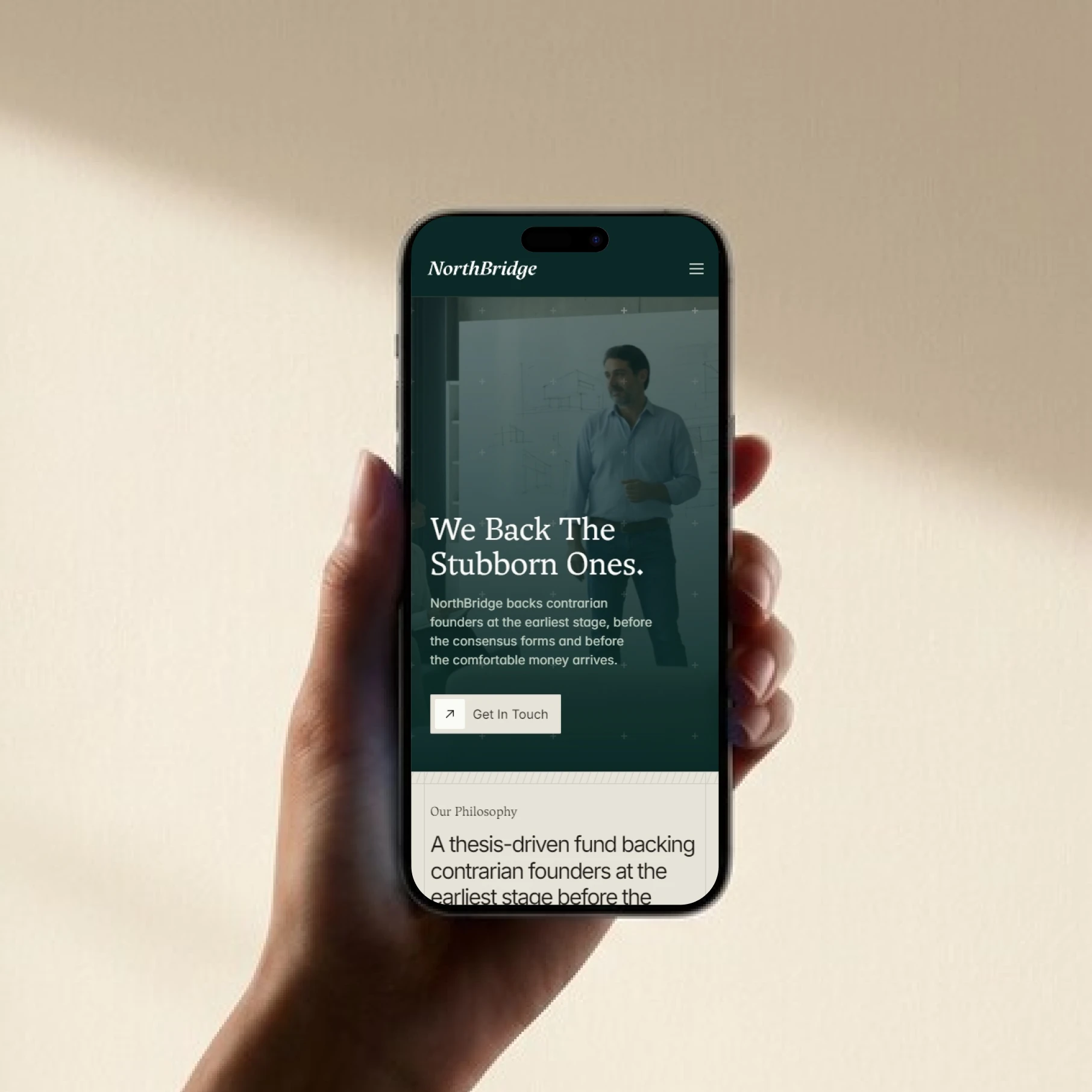 NorthBridge website on phone: We Back The Stubborn Ones.