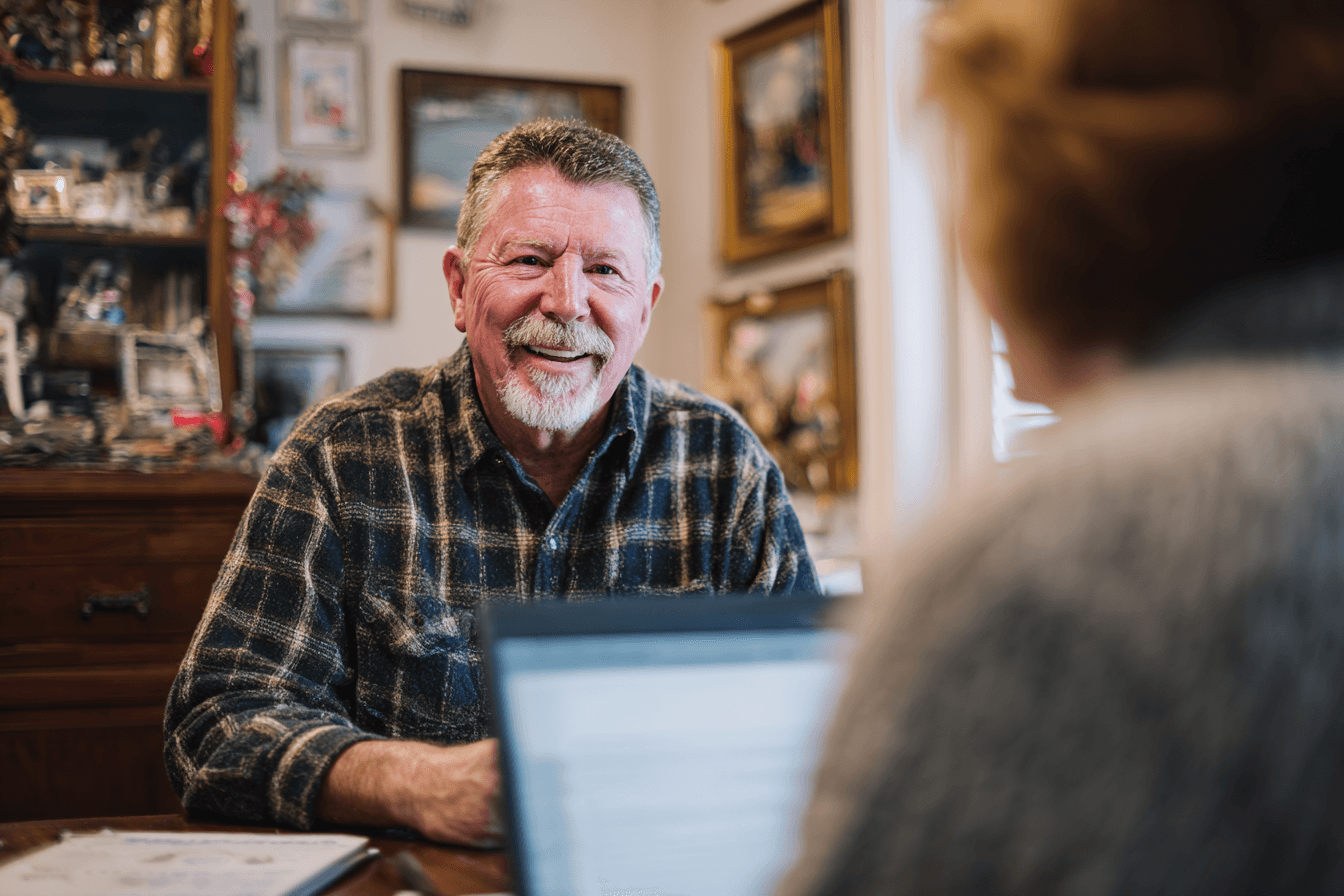 a home care agency owner, male in his 50s, talking with a state auditor in his home care agency.