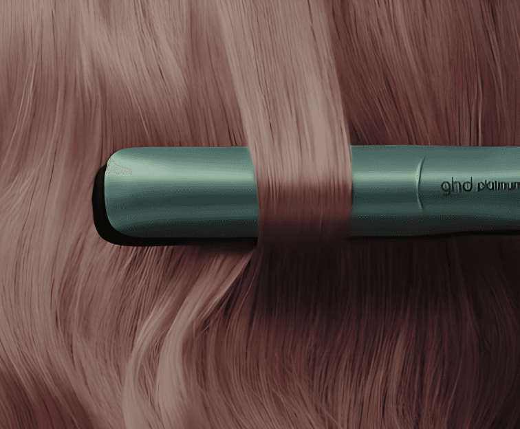 Close up of a flat iron on a brown hair