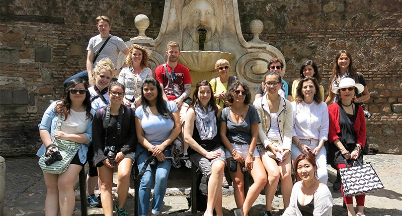 group of people by the fountain
