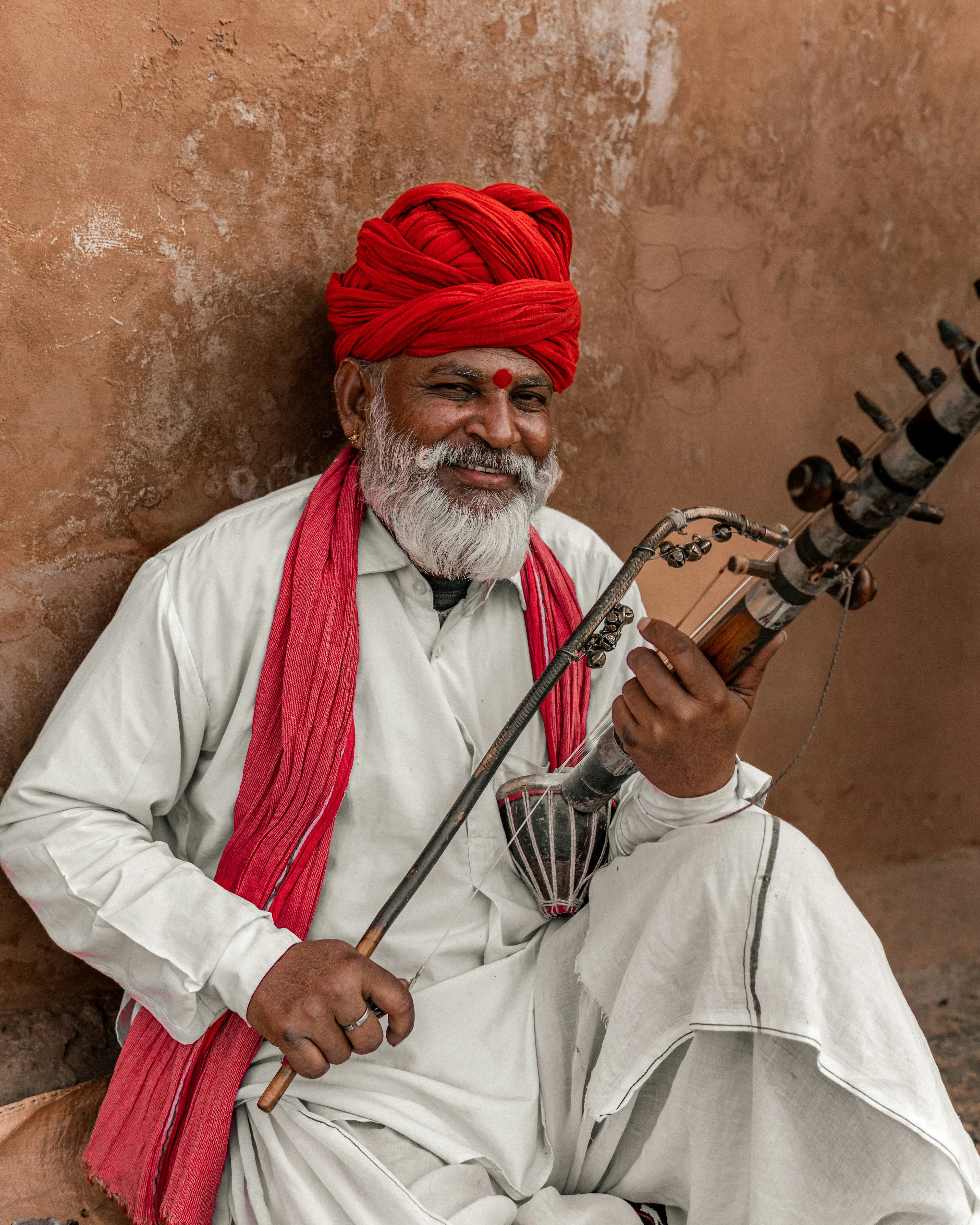 Old indian folk singer with music instrument