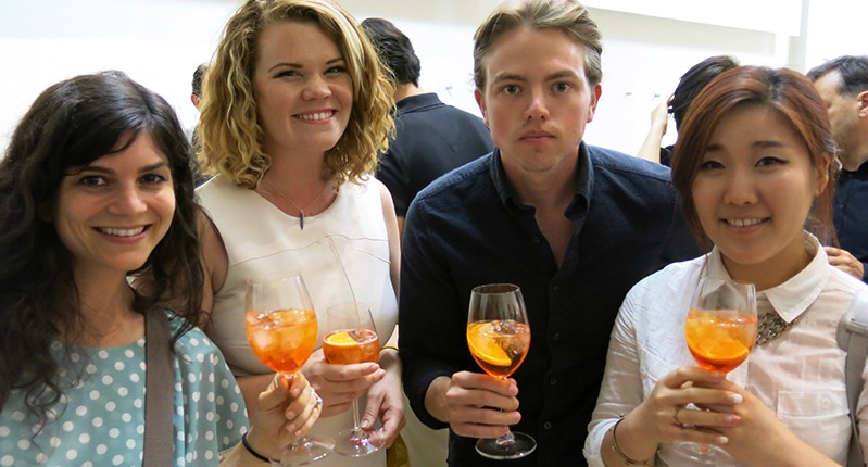 four people with champagne