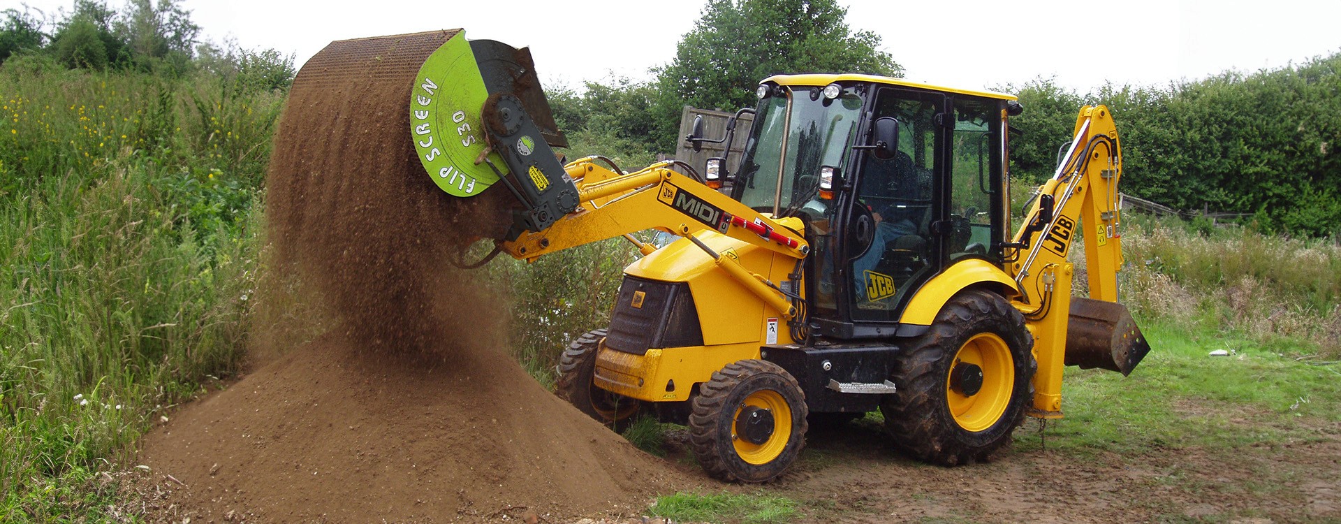 FlipScreen Attachment on a Back Hoe