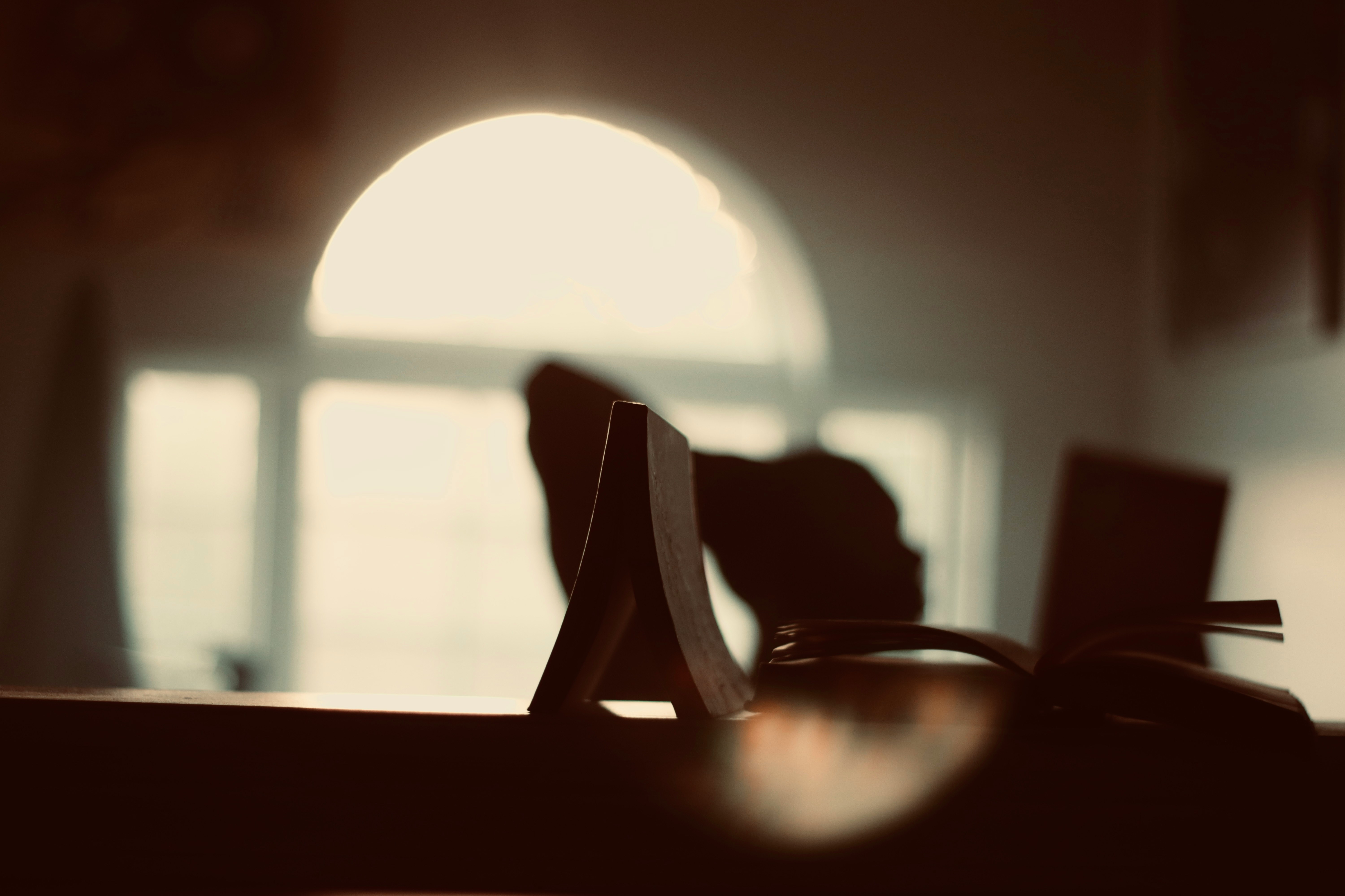 black chair near glass window