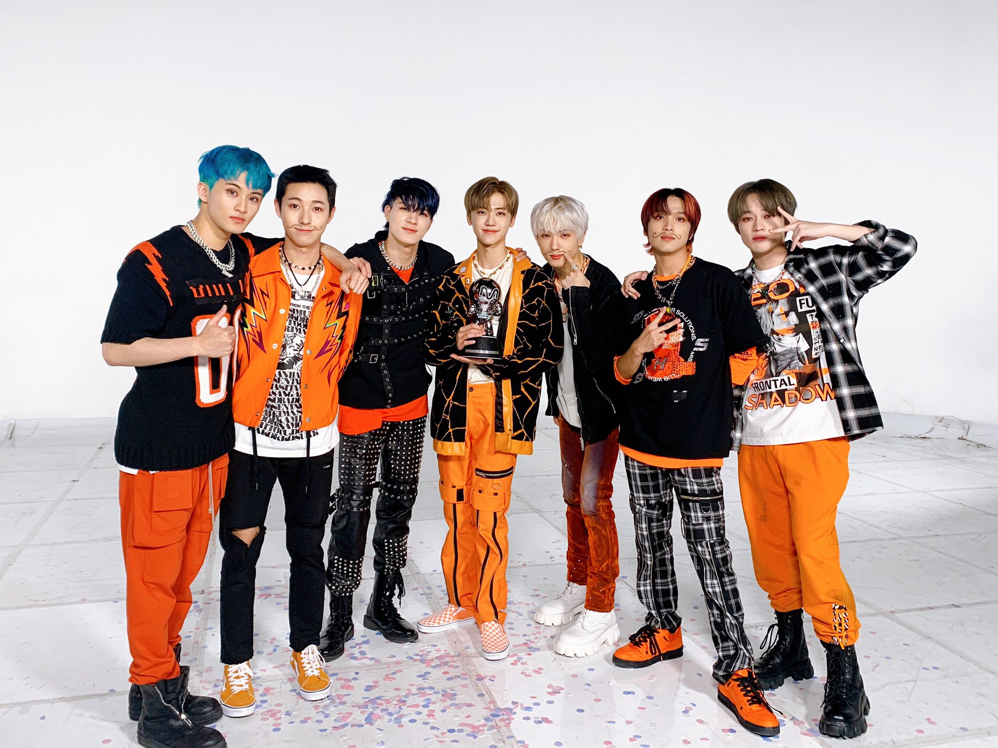 Streetside billboard with flyposters of the Batch.Works brand and illustrations