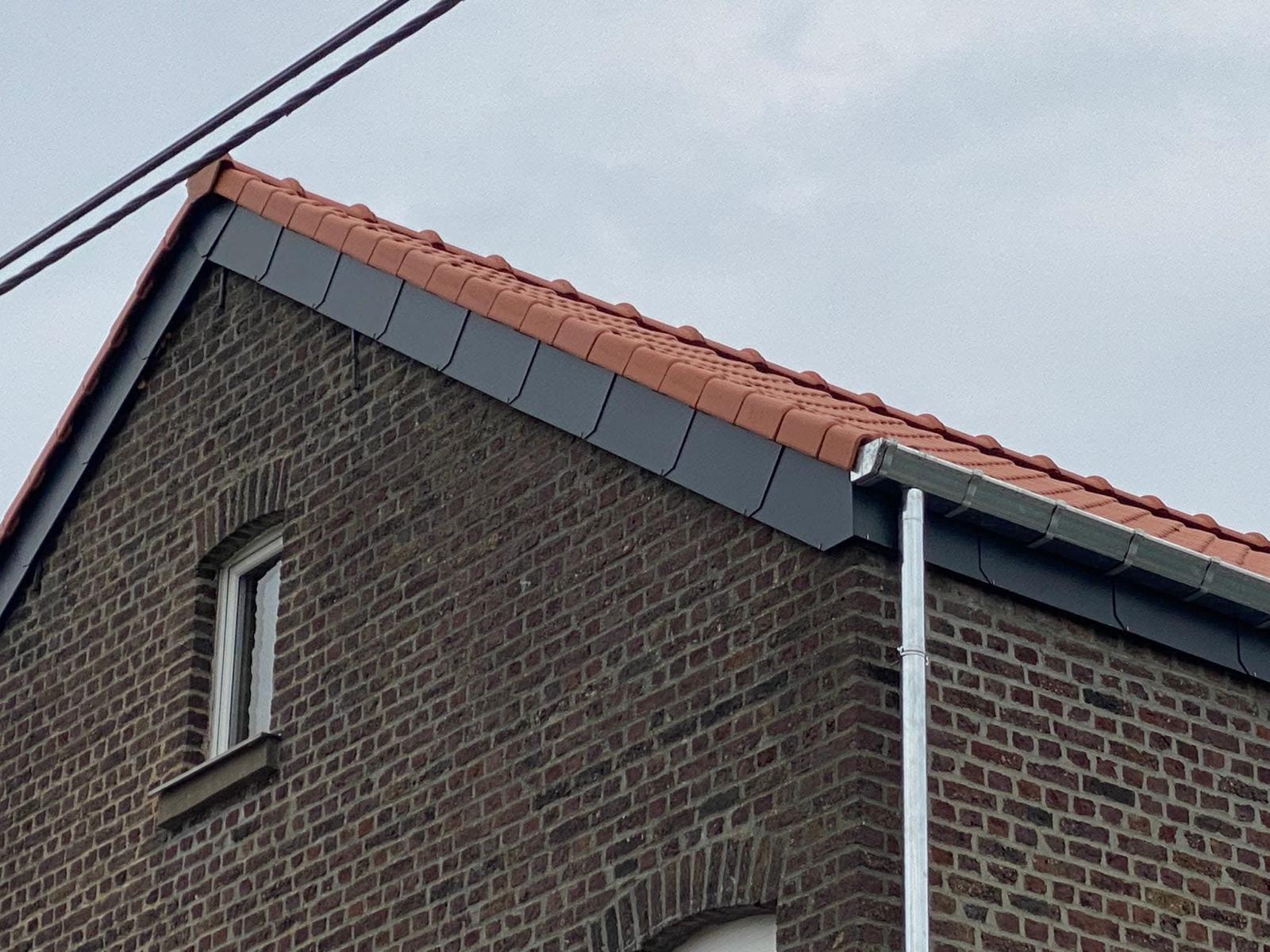 a man wearing a red hard hat and jacket