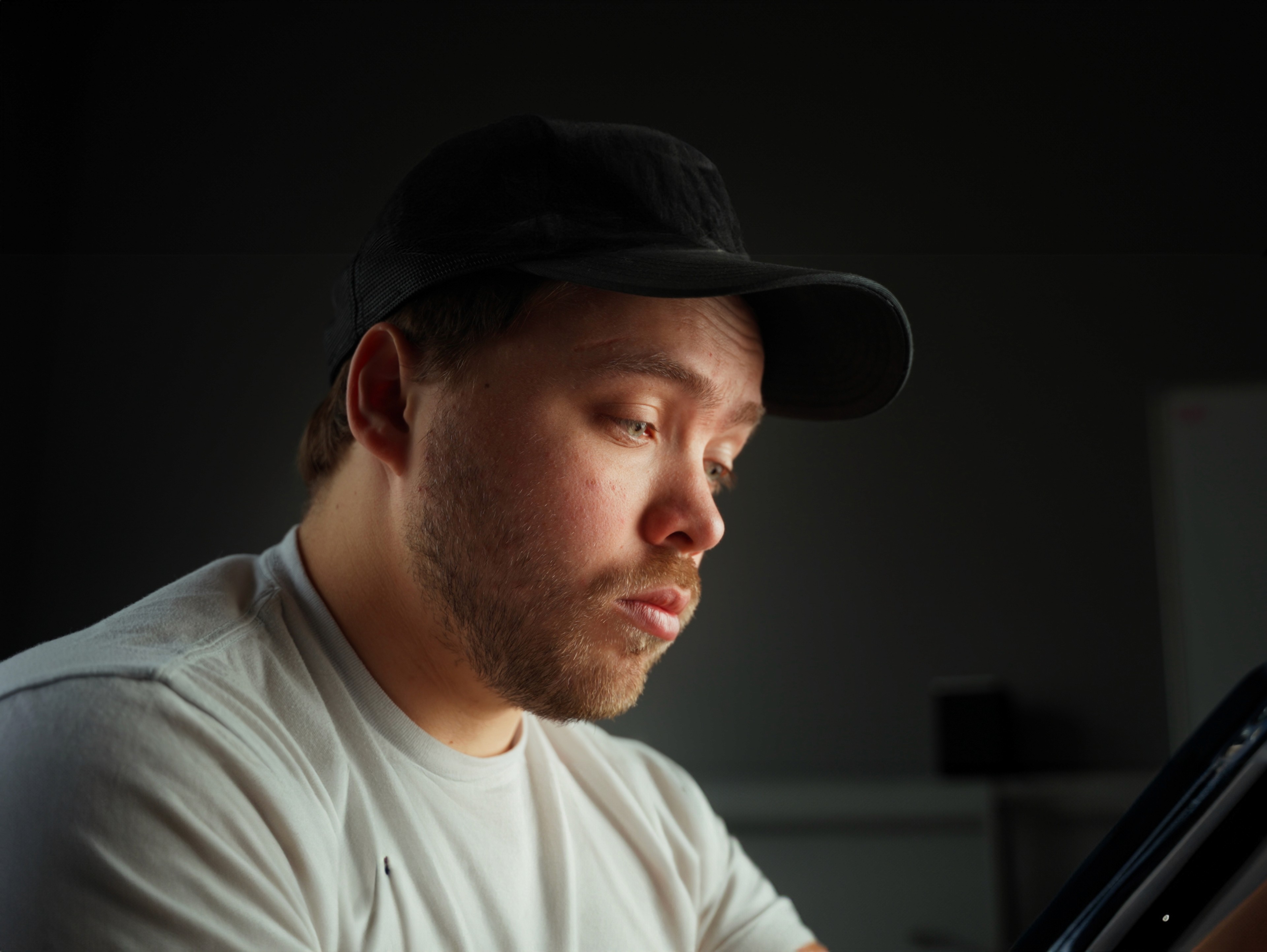 a blurry photo of a person standing in front of a wall
