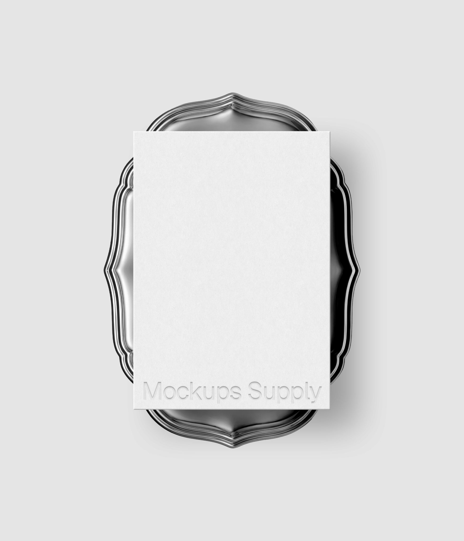 Wedding invitation mockup with embossed typography on decorative silver plate for elegant stationery design showcase