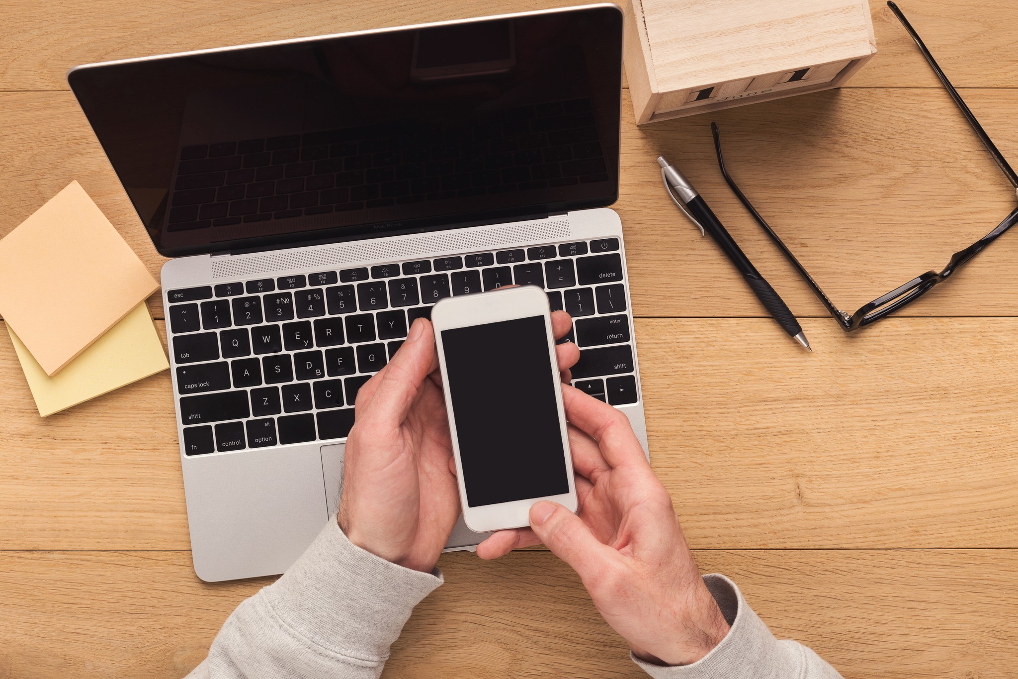 Workspace With a Laptop and Mobile Phone on Desk