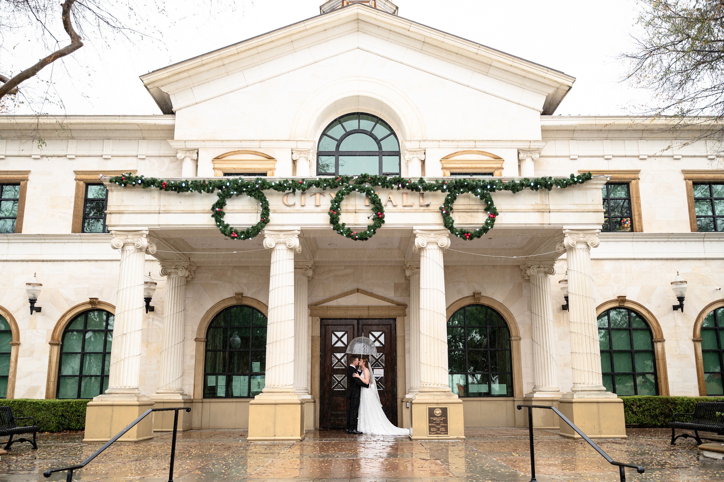 Flat lay wedding details with bouquet, rings, and sparkling bridal heels