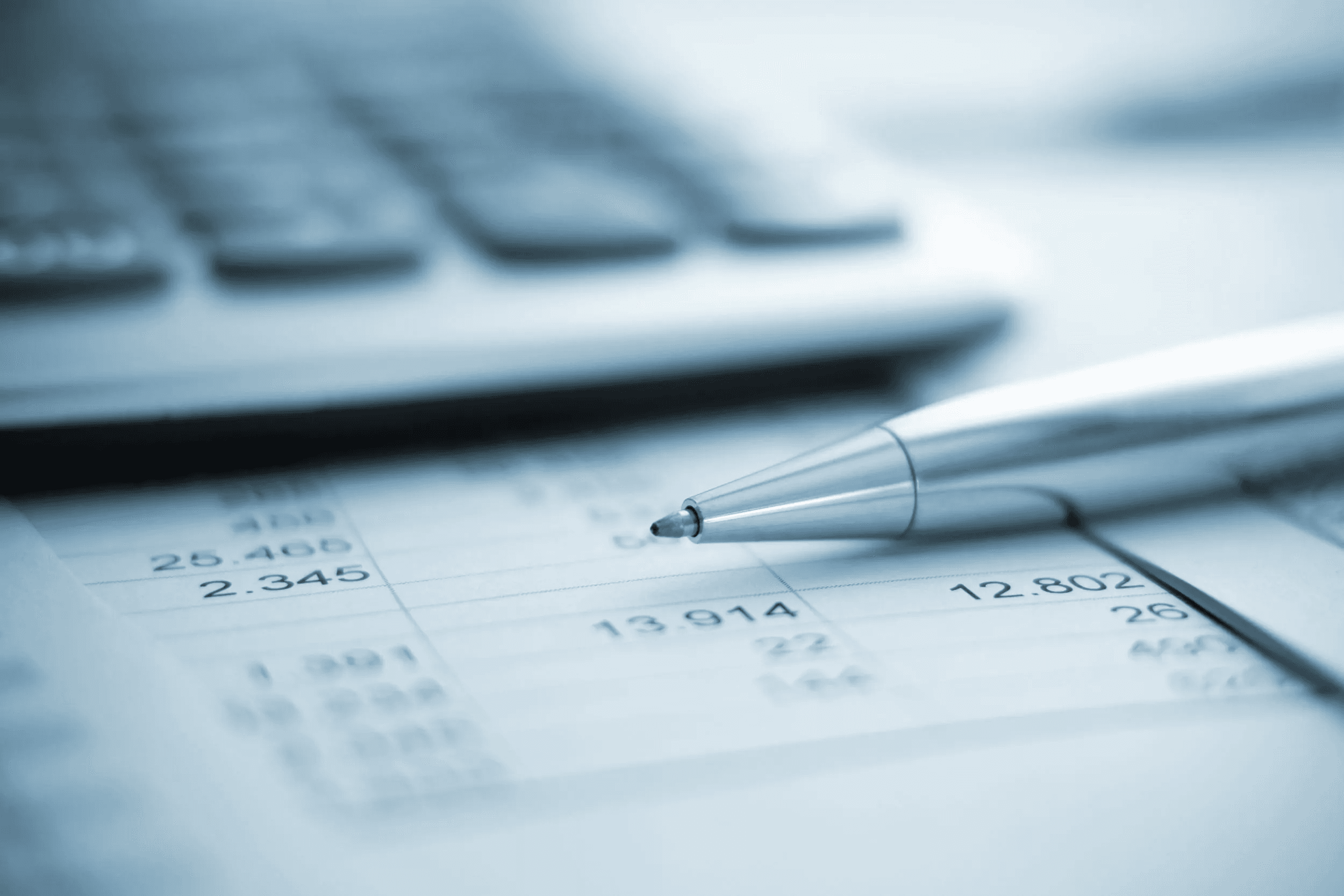 Pen resting over tax papers - Close Corporation Taxation