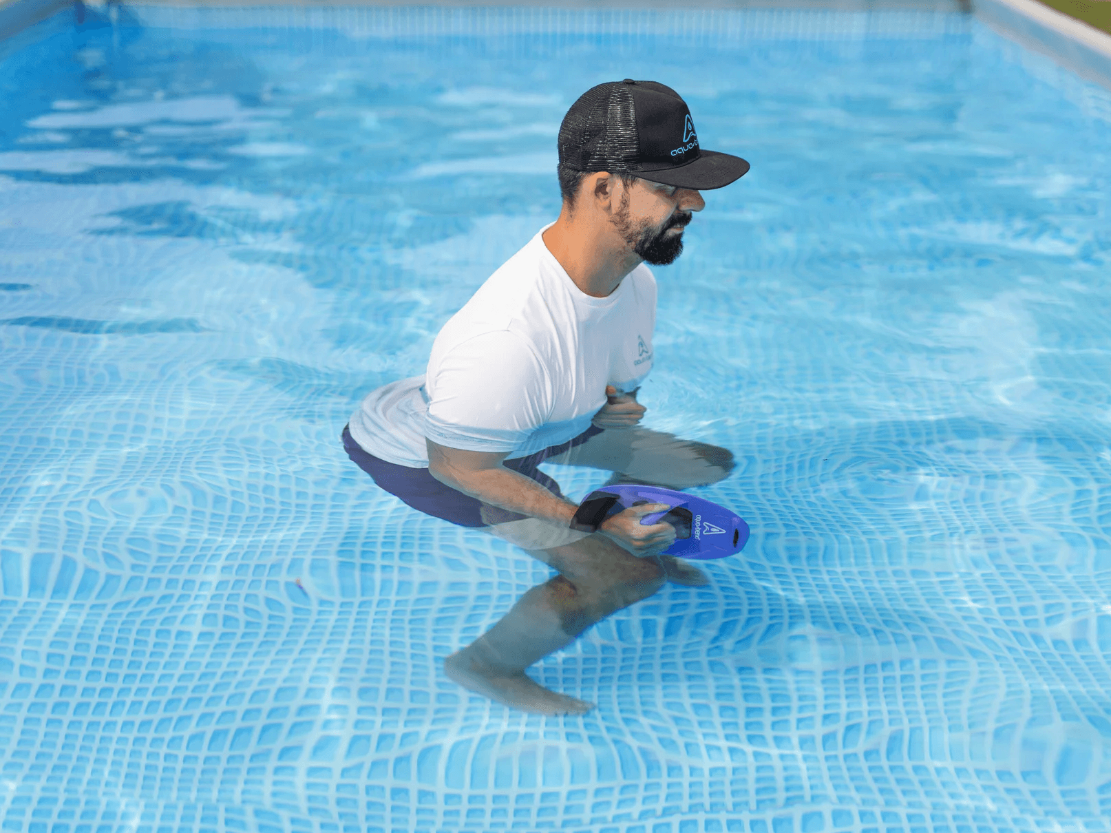 Man in water performing shoulder rotation exercise with Aqua-Bend FLOW disc, recovery session