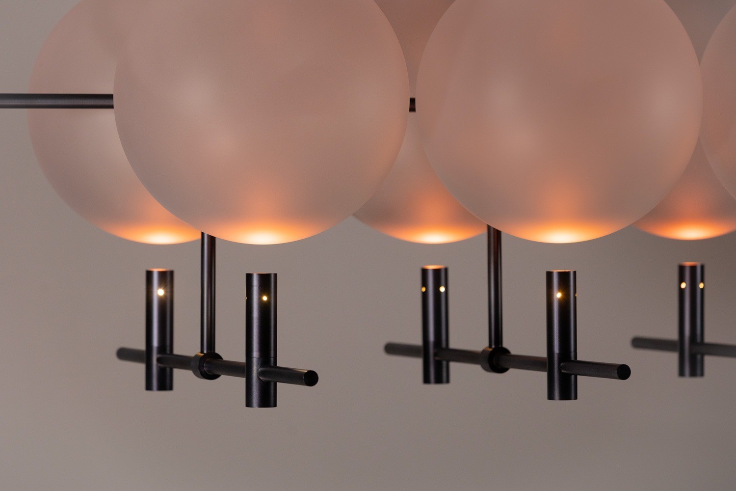 Angled view of Luna II vertical luminaire showing elongated sculptural composition and spatial depth by Jiri Krejcirik
