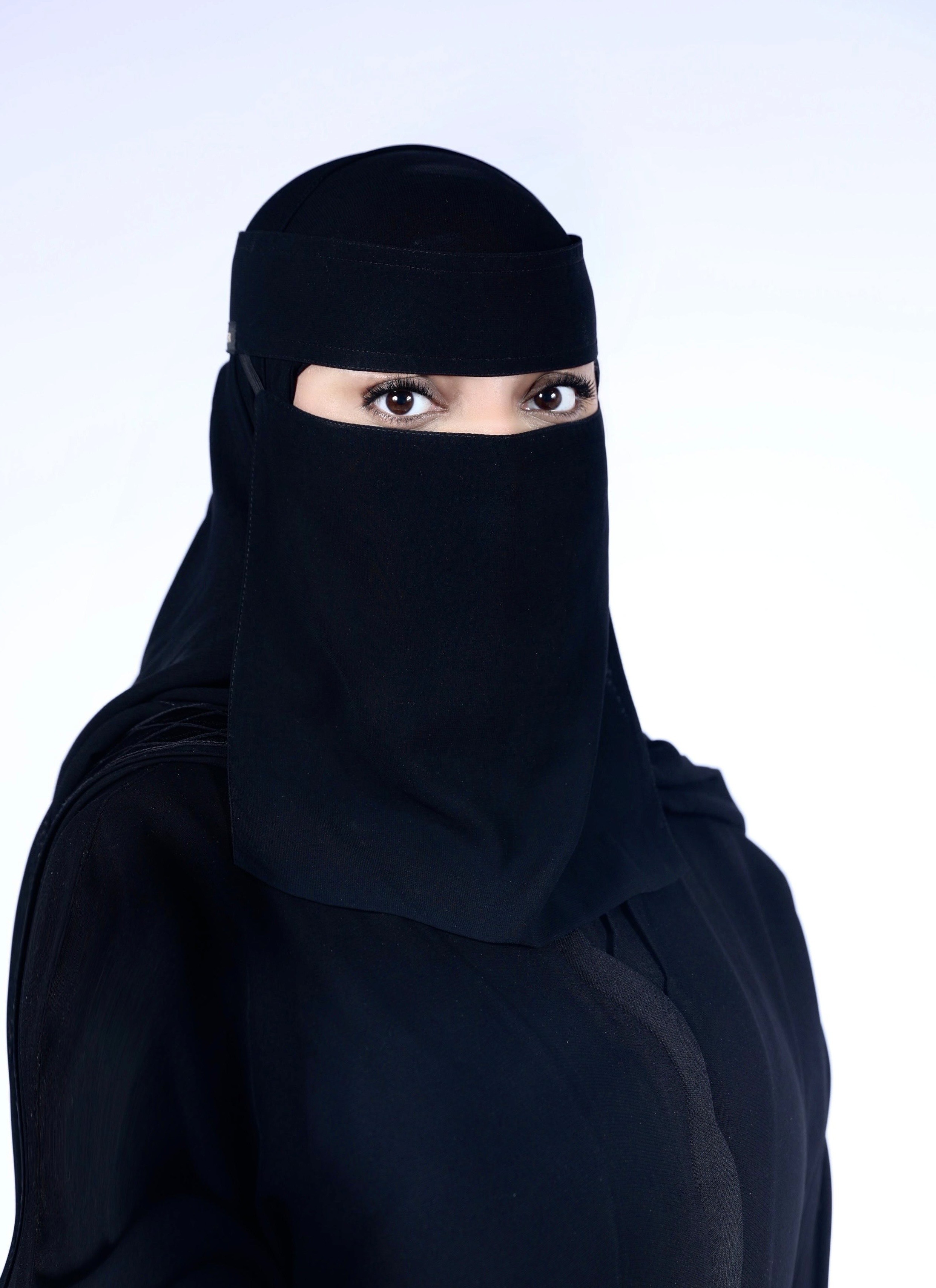 brown rock formation under white clouds during daytime
