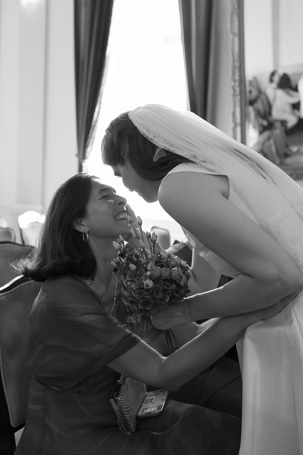 Bride and her mum sharing a moment and holding each other