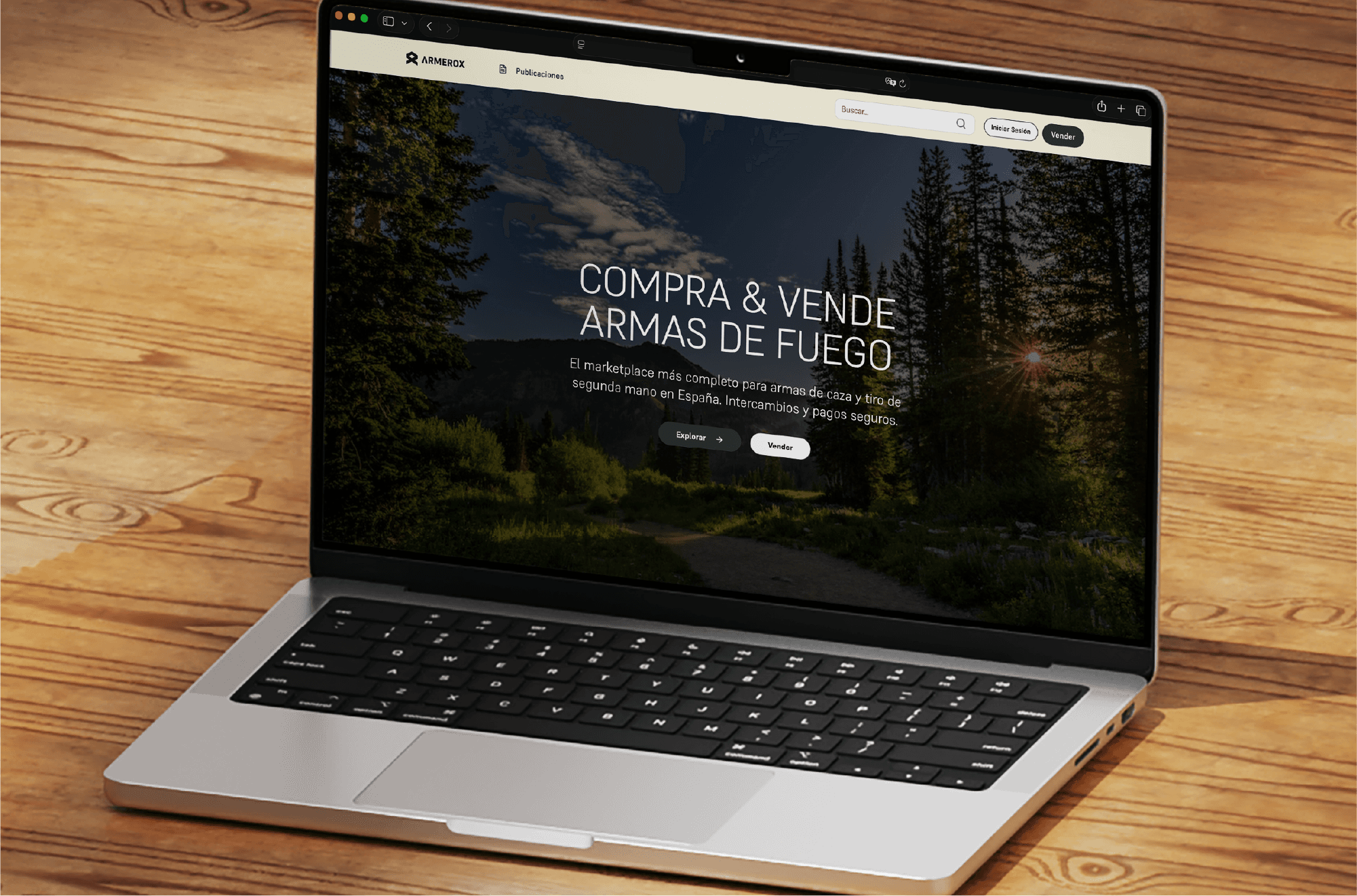 Laptop on a wooden desk with the Armrox website on screen