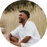 Man with white polo shirt smiling