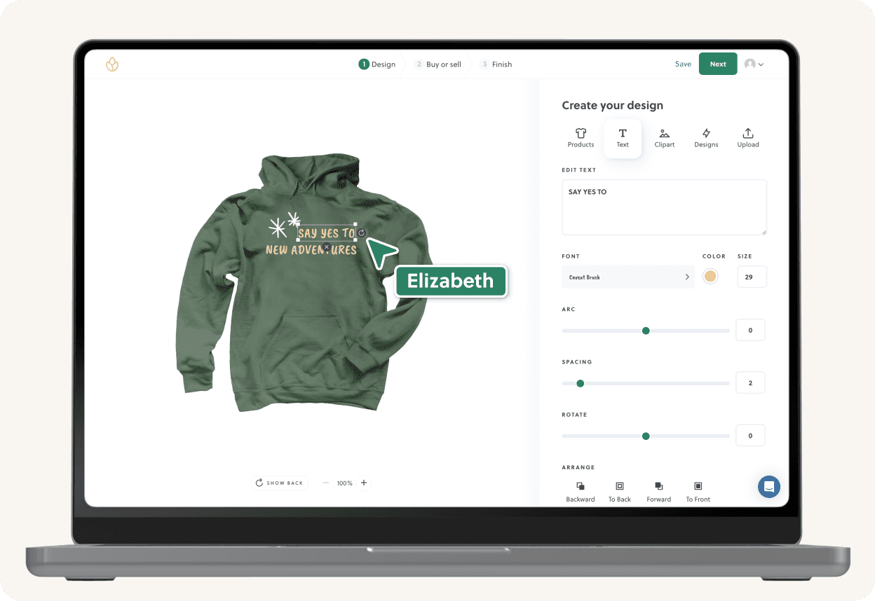 Personalised green hoodie design on a laptop screen. Design tool shows options for text, color and placement.