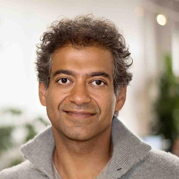 Naval Ravikant, entrepreneur and investor, smiles for a portrait.