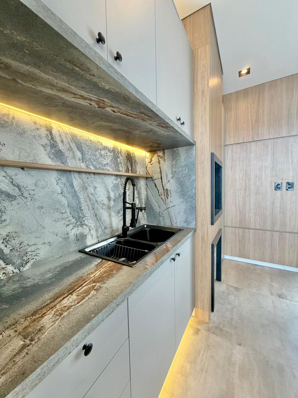 white ceramic sink with faucet