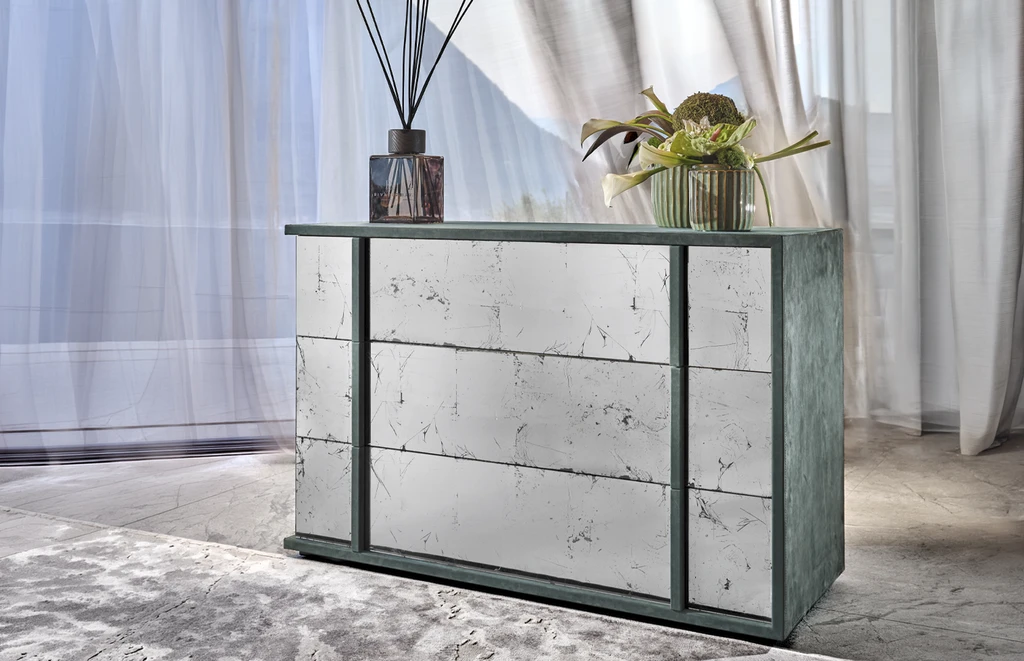side view of a leather covered cube chest of drawer and eglomisè glass
