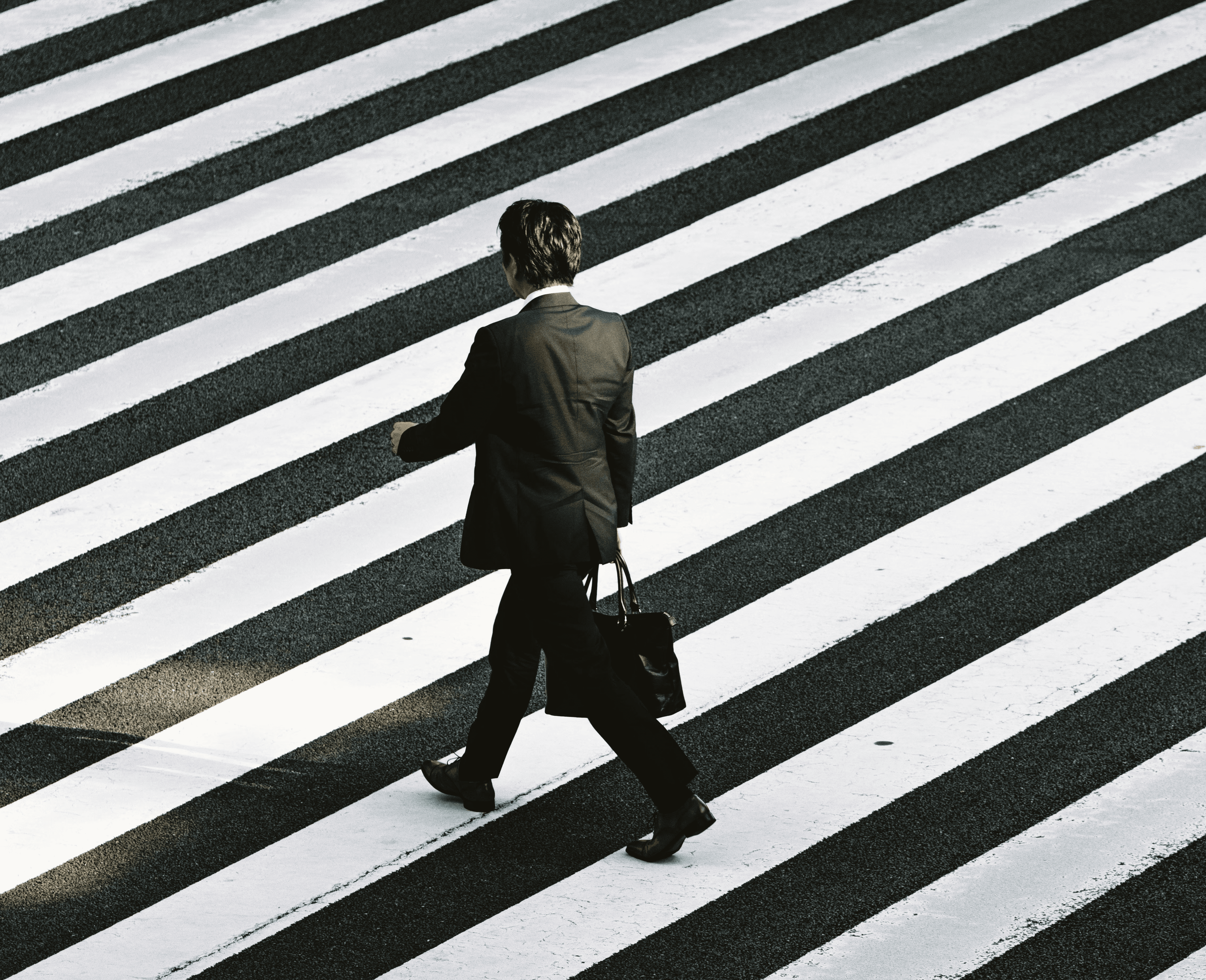 Man walking over crosswalk