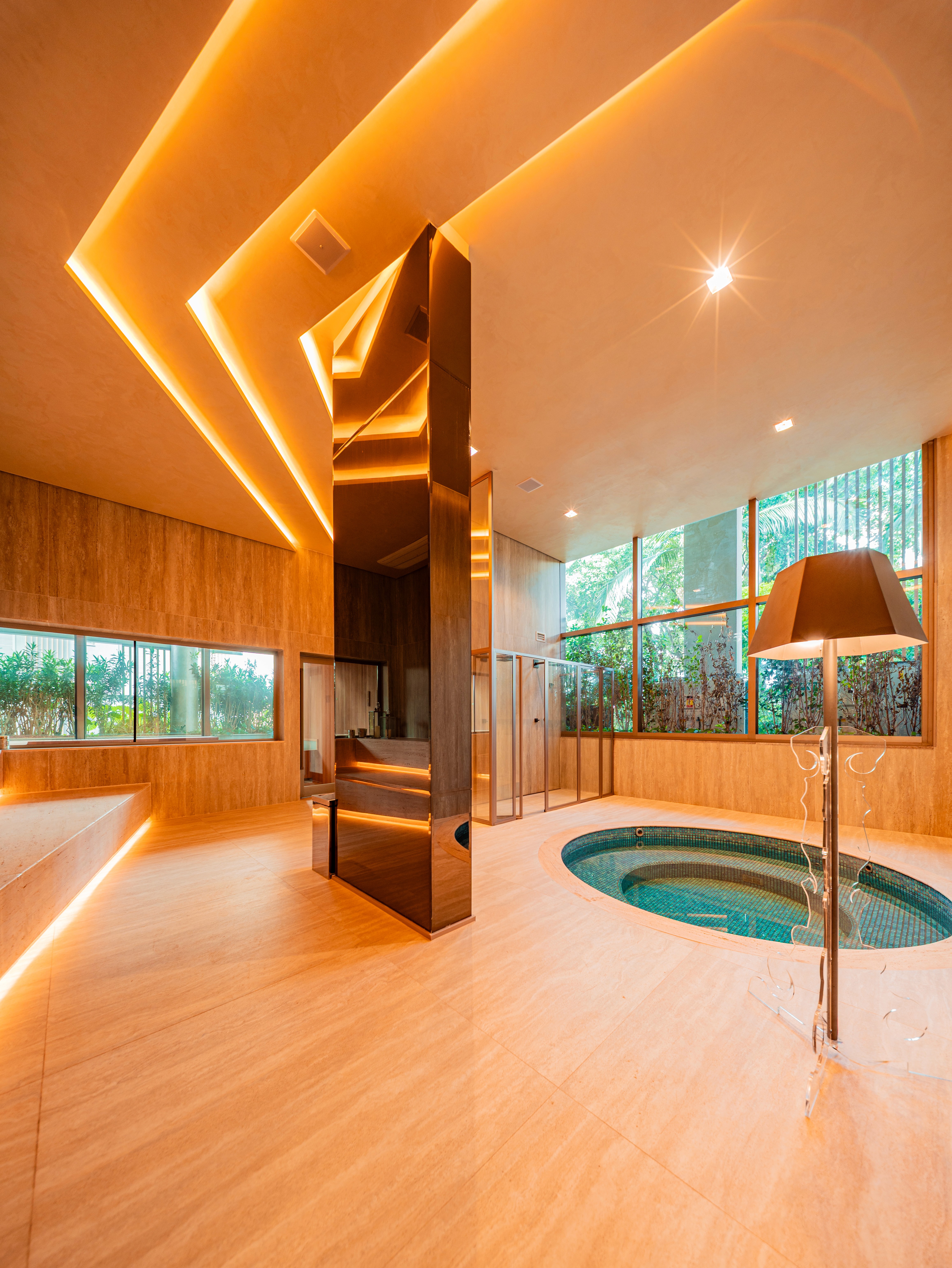 Curved modern skyscraper against a clear blue sky.