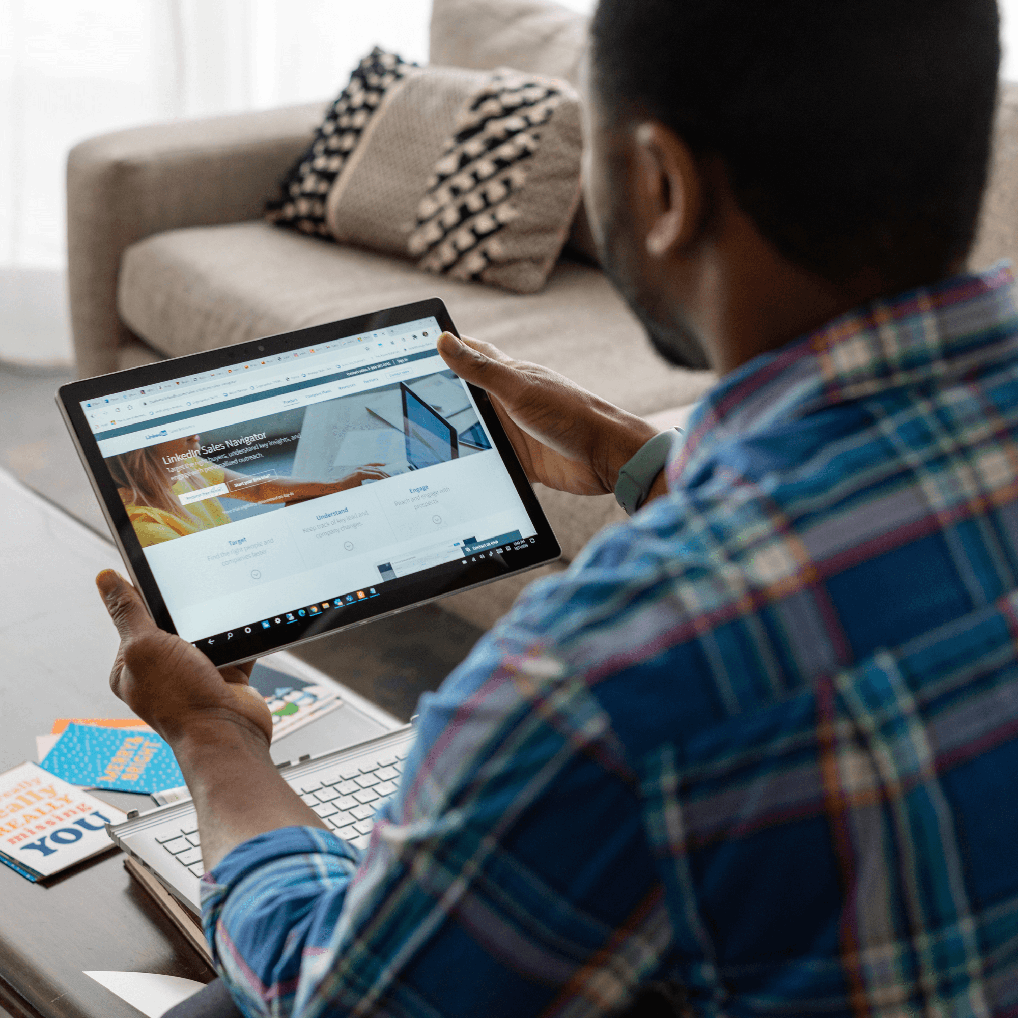 a man sitting in front of a laptop computer