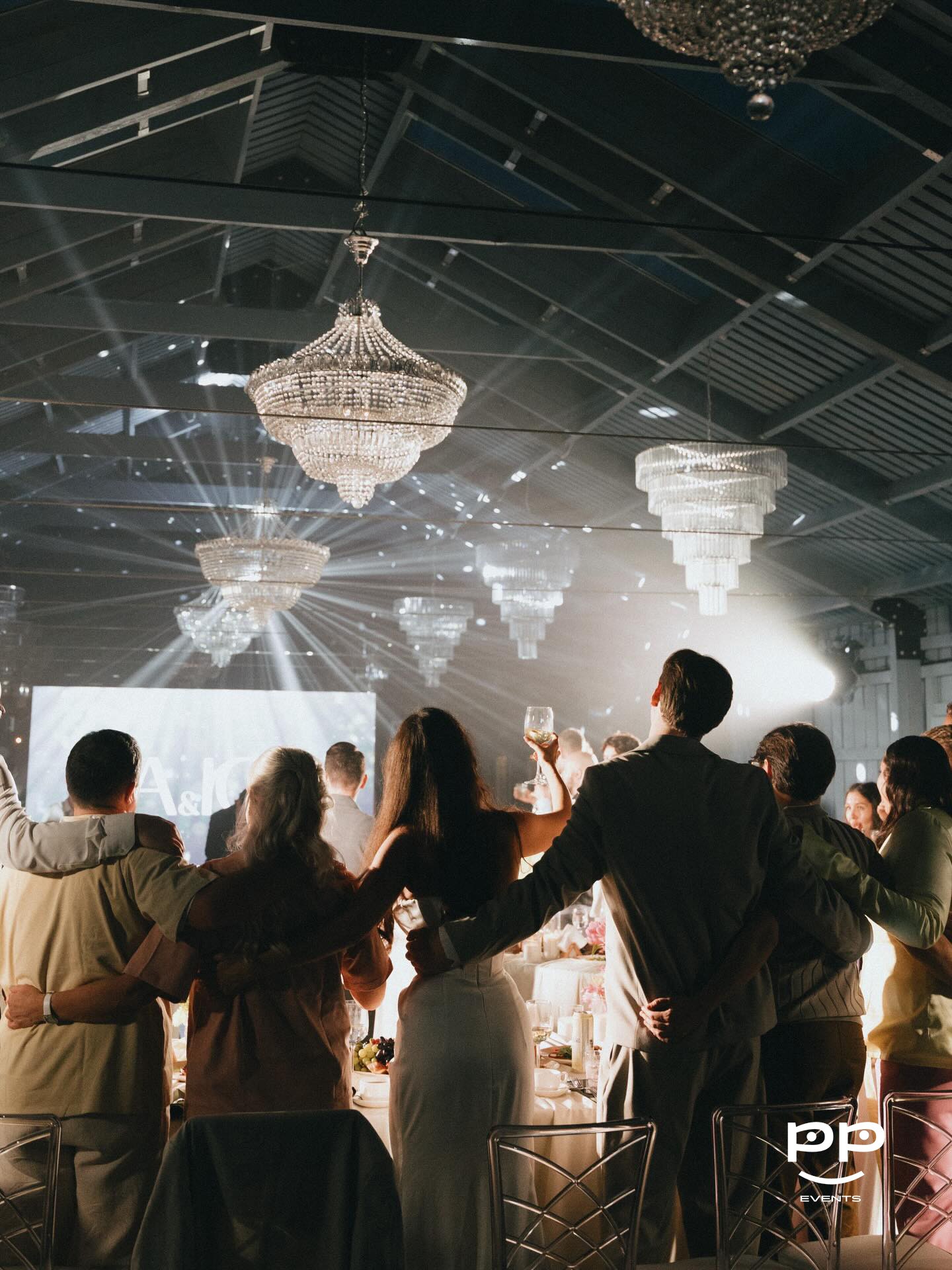 A gradient image transitioning from dark black to light gray tones.