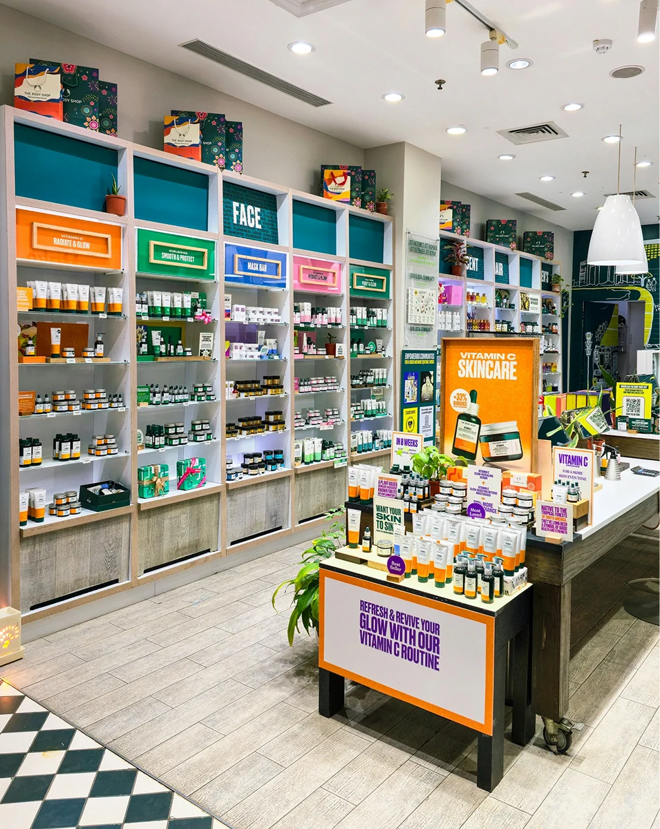 Pet supplies displayed on shelves inside a pet shop.