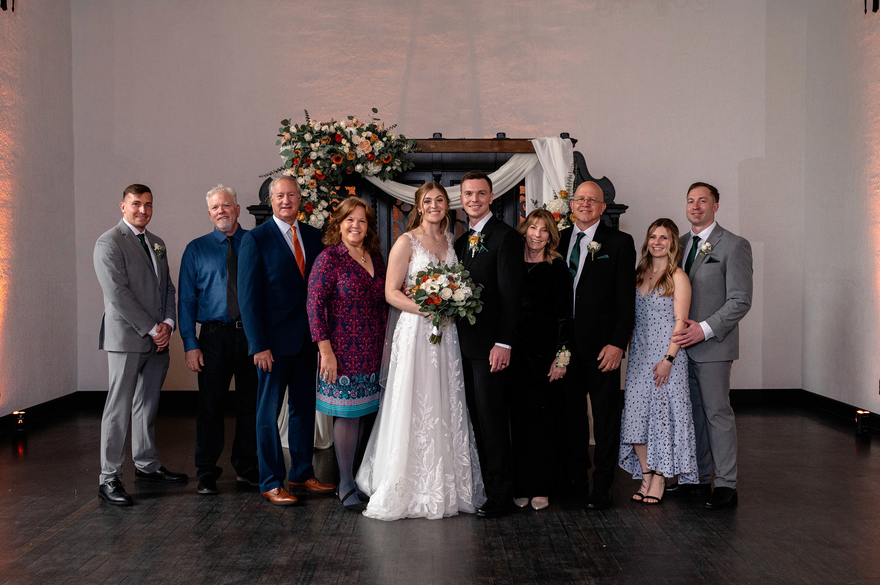 Flat lay wedding details with bouquet, rings, and sparkling bridal heels