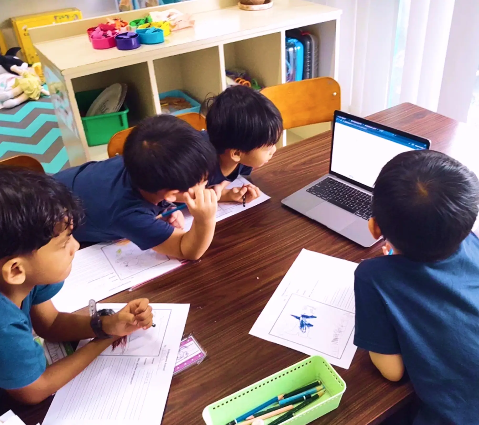 Group of students in front of laptop learning using Flint 