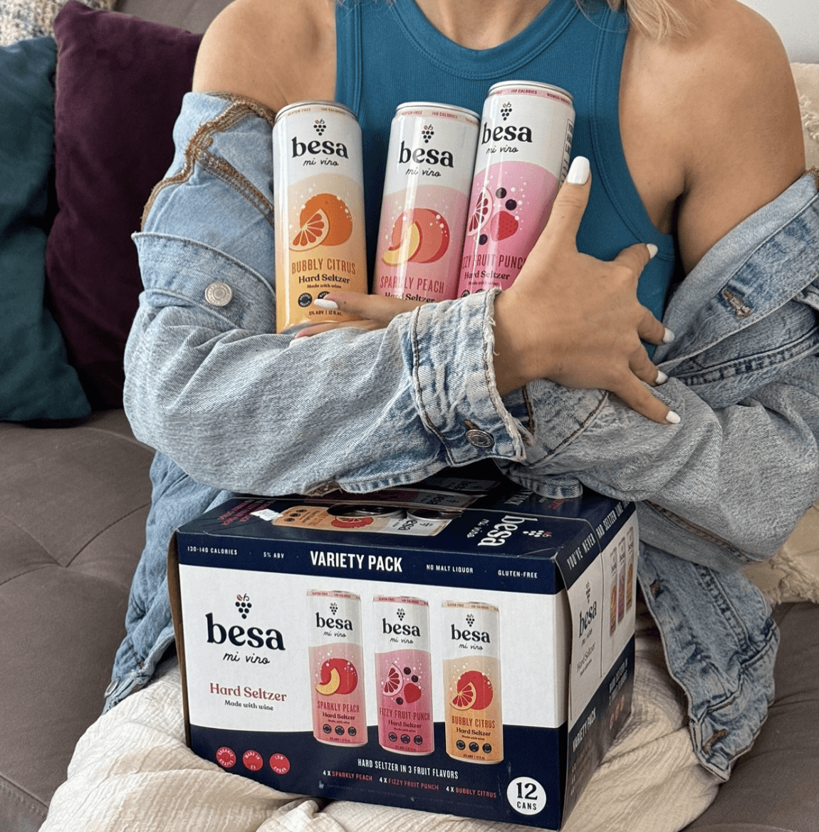 woman with cans of hard seltzer