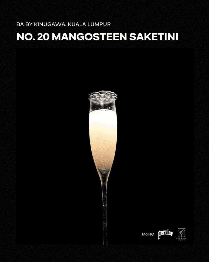 A cocktail named Mangosteen Saketini served in a tall glass, showcased against a dark background. The drink features a light, frothy top with bubbles and a sleek presentation.
