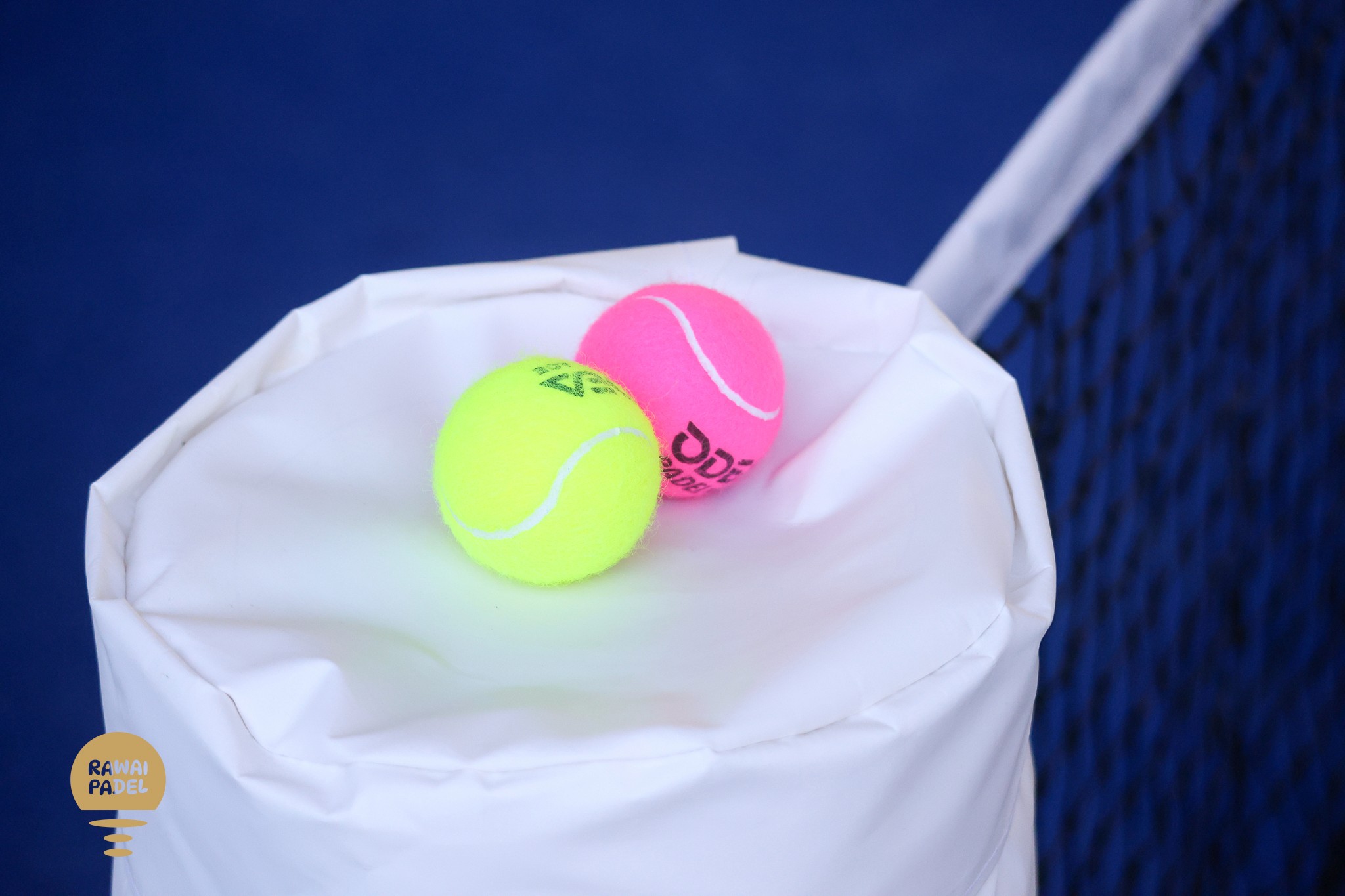 person holding orange and white polka dot round ball