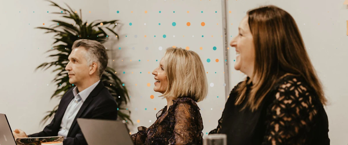 People within a meeting looking towards the left