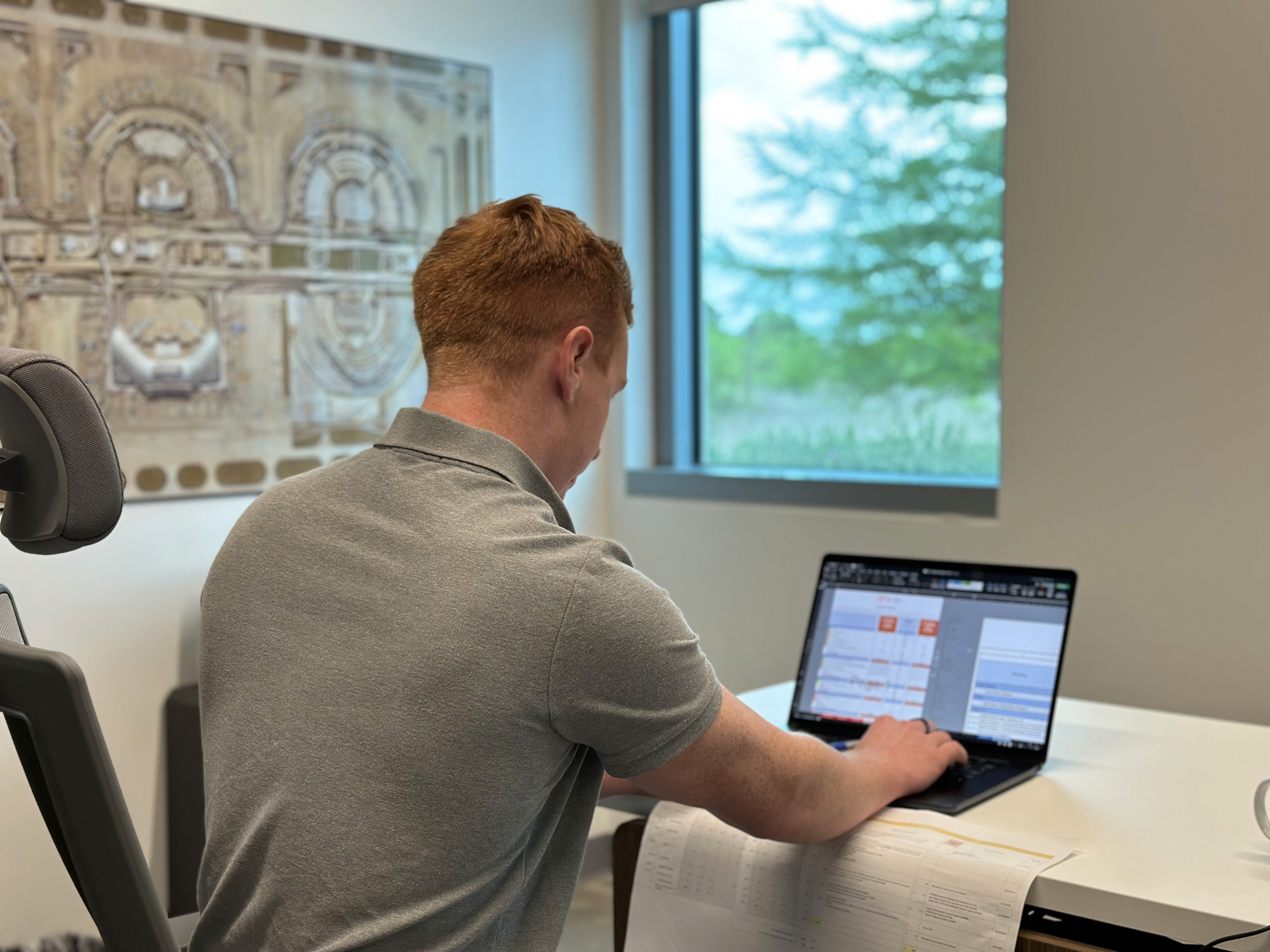 man sitting beside woman looking at a contract on DocuSign