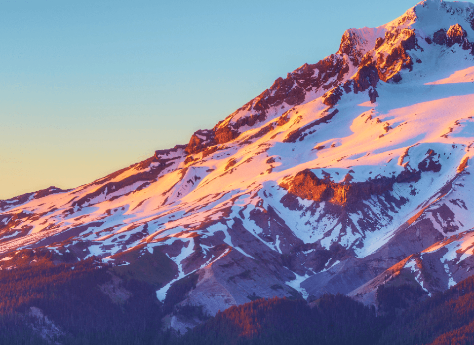 The soft warm pink of the sky and mountain inspired the Alpine Glow accent color