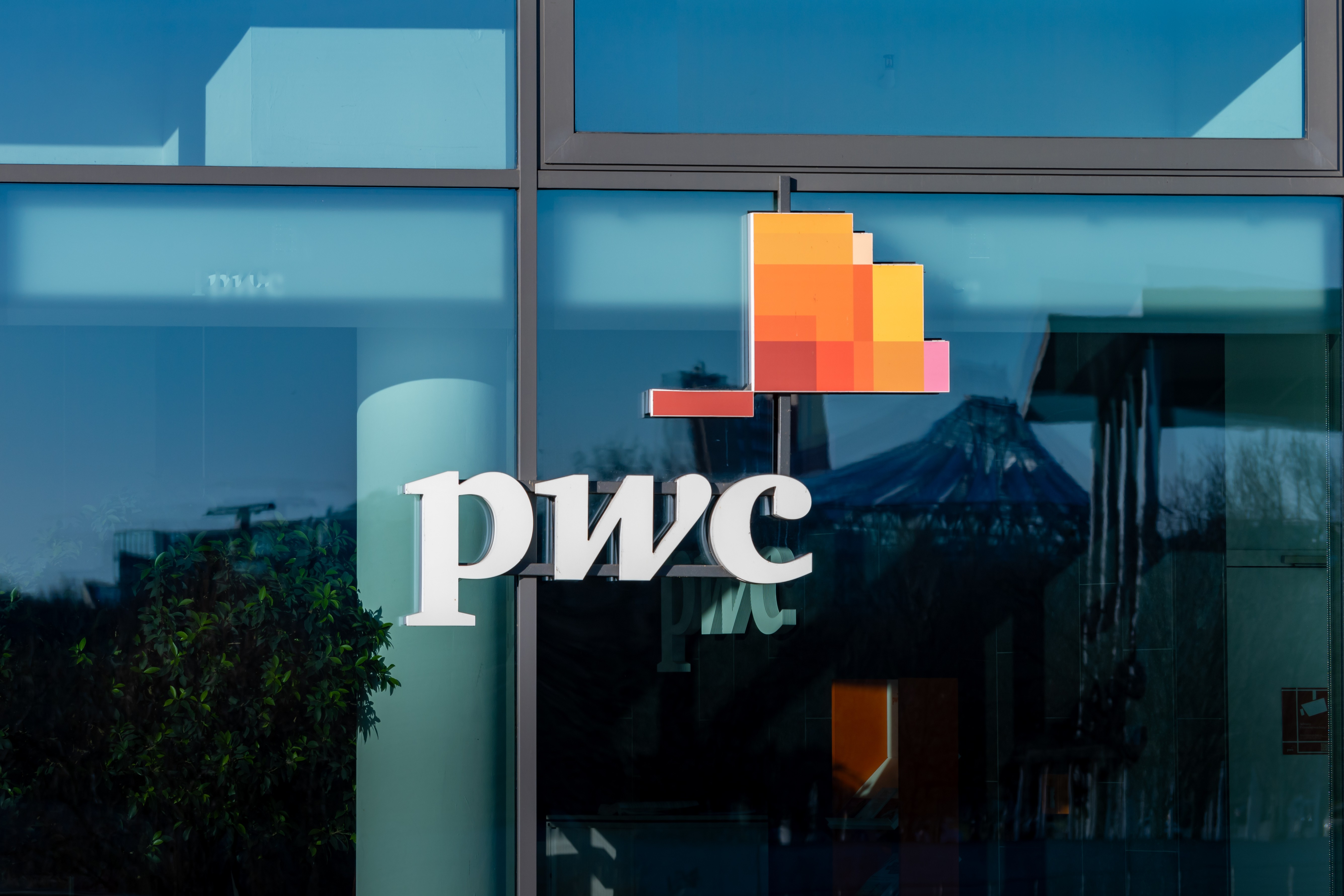 PwC logo on building