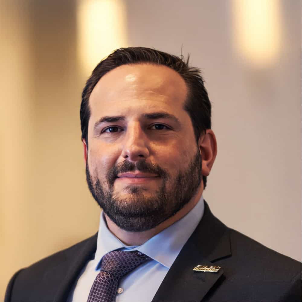 Dr. Jason M. Goldman, President of the American College of Physicians, in formal attire during a professional event.