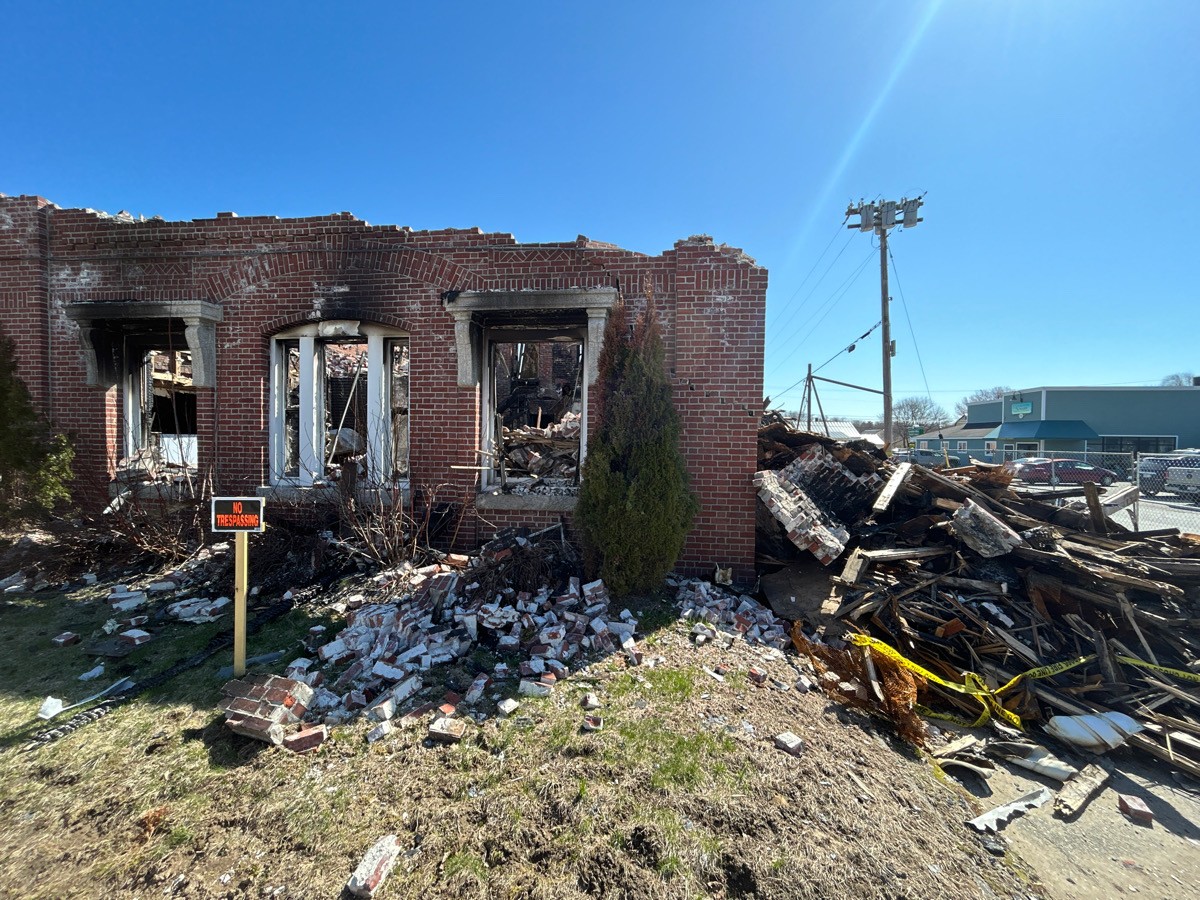 Photo of exterior of damaged building - Our Promise - Infinity Insurance Services