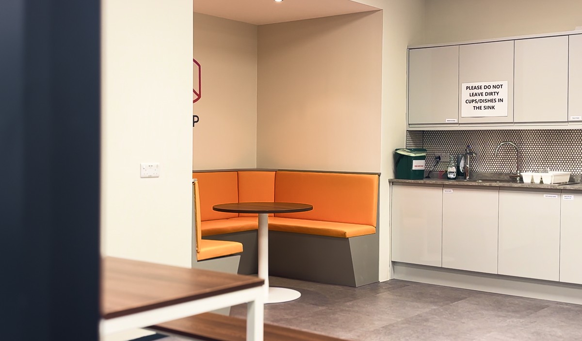 BRand New Office Kitchen with vibrant orange seats