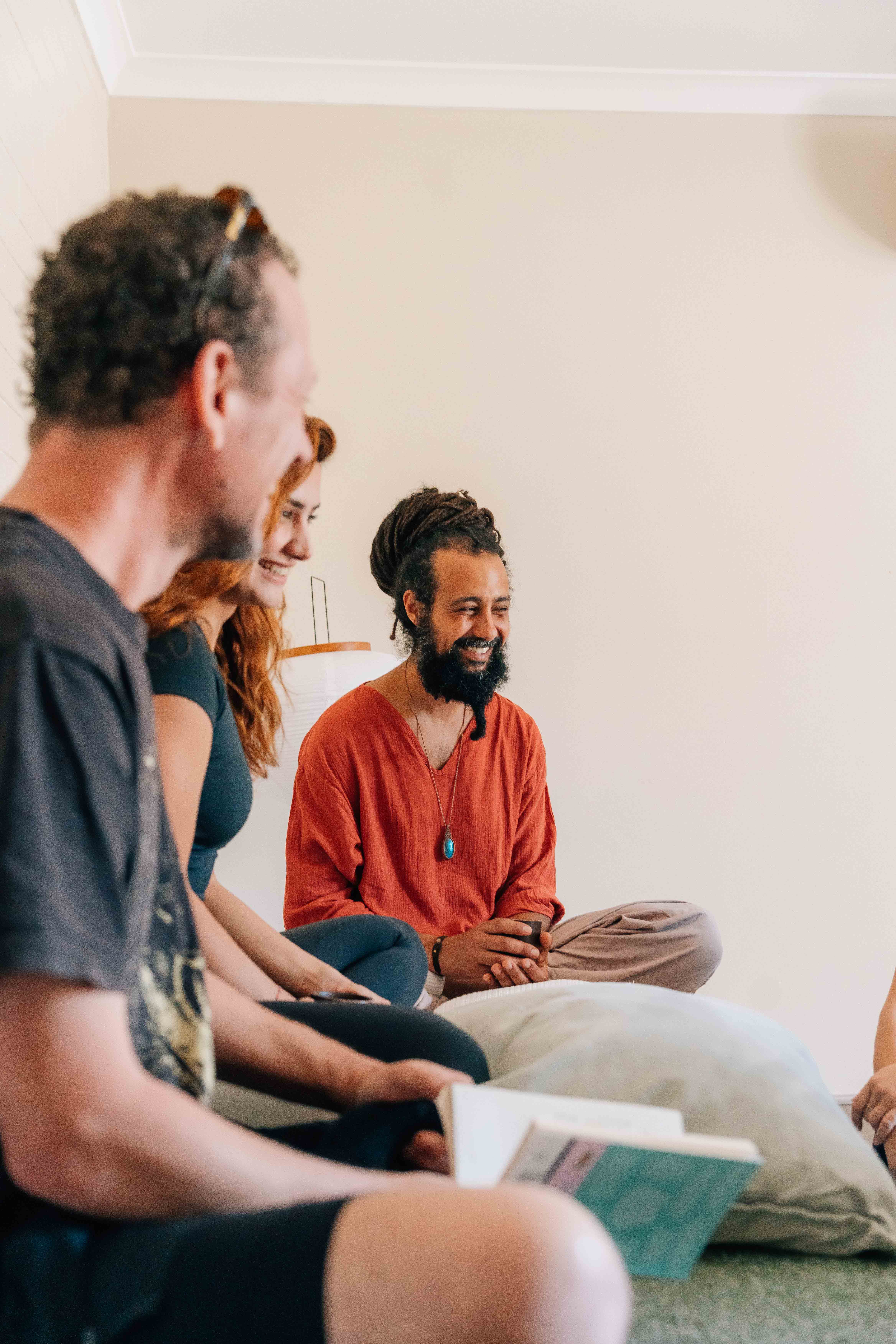 man in white and brown striped shirt smiling