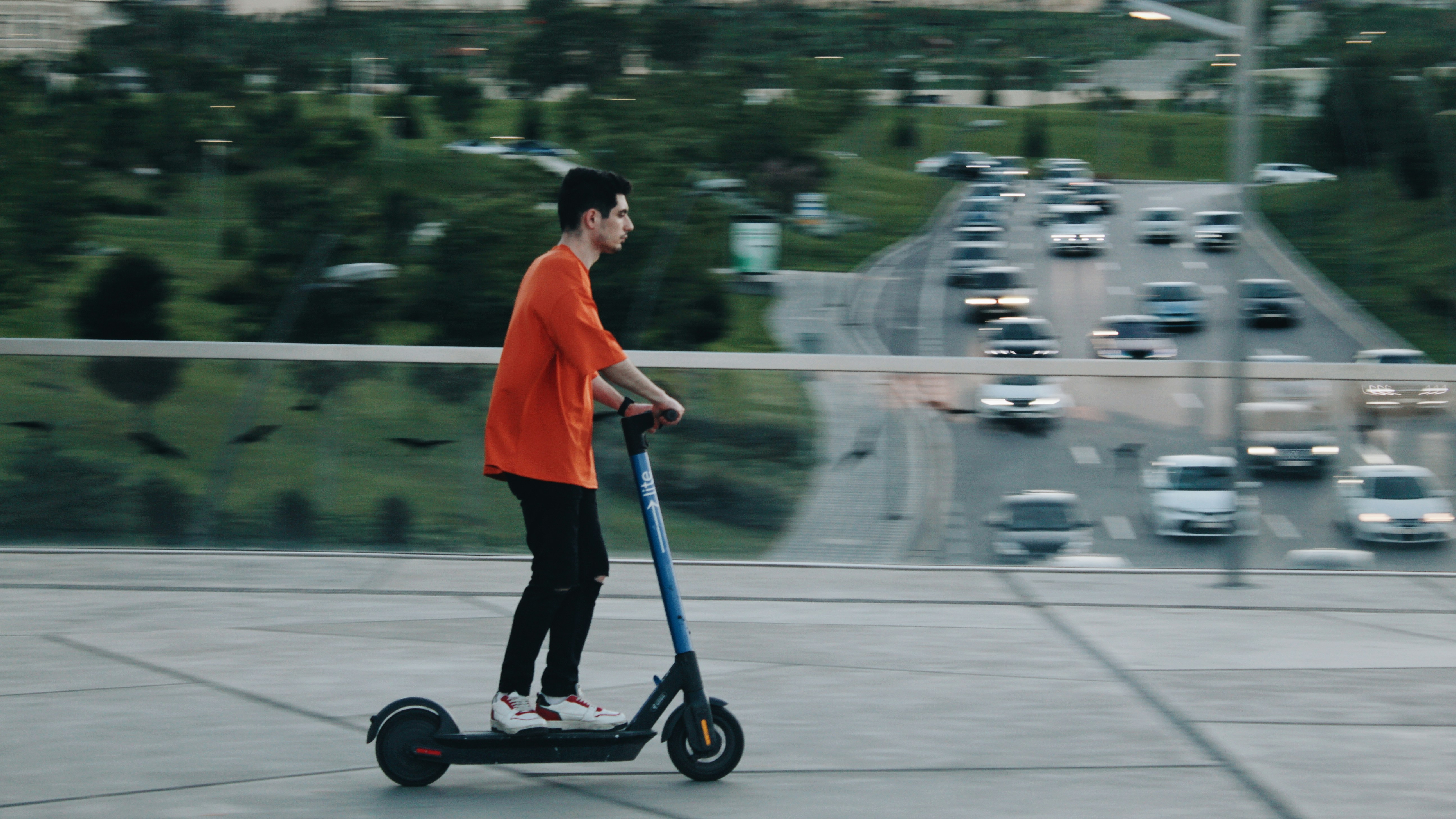 person a scooter with a hunch and riding unstable