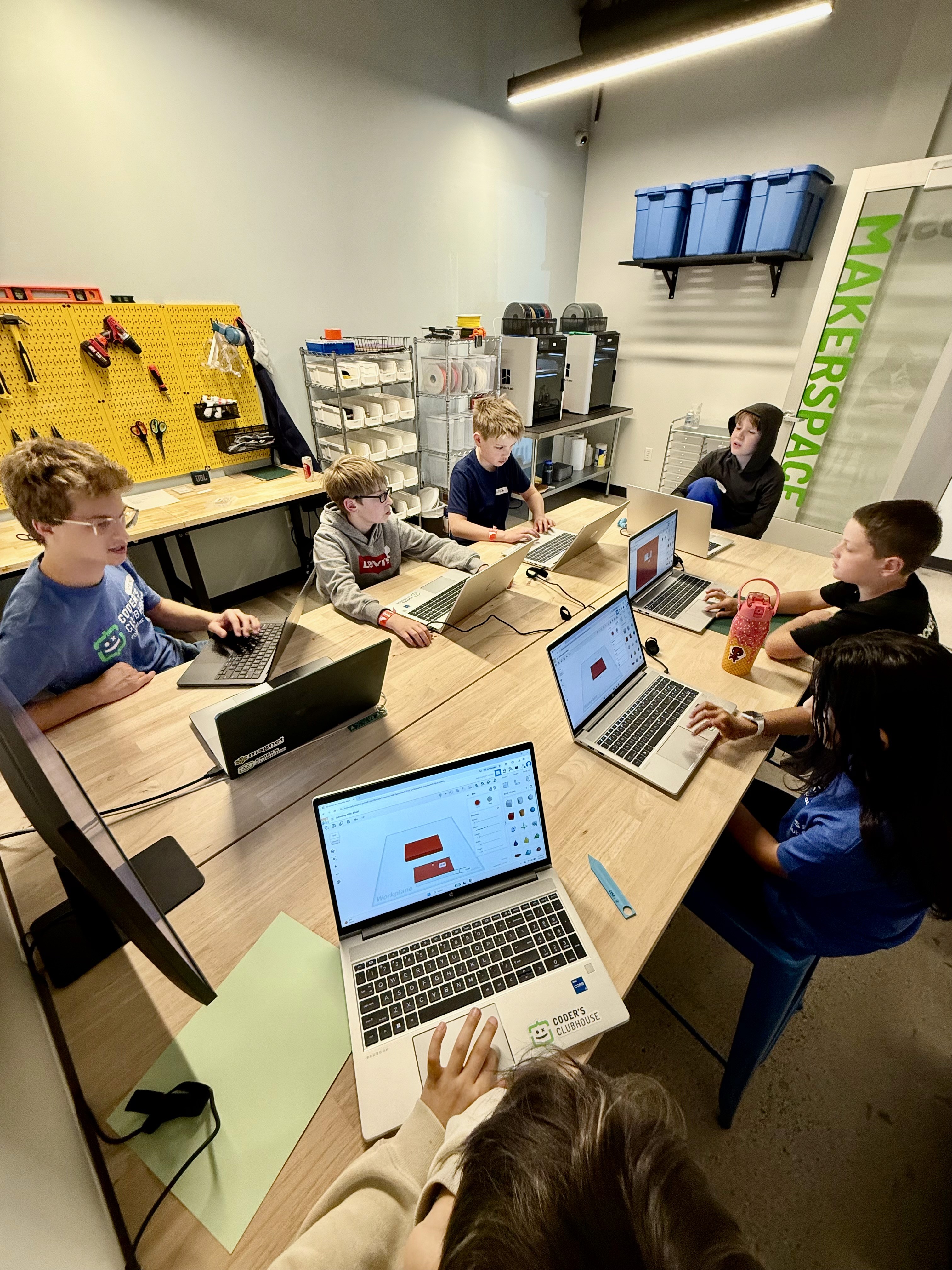 Kids playing with micro:bit controllers