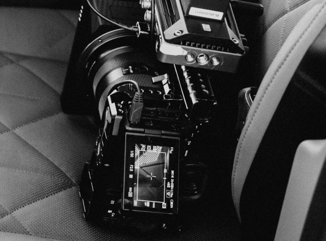 Black-and-white image of a camera mounted on a rig
