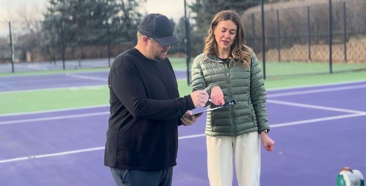 Municipal tennis court inspection with contractor and facility manager discussing resurfacing funded by government grants